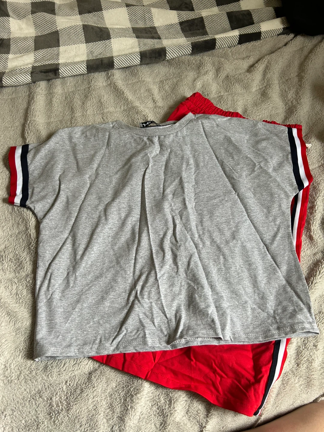 Grey T-shirt with striped sleeves and red skirt