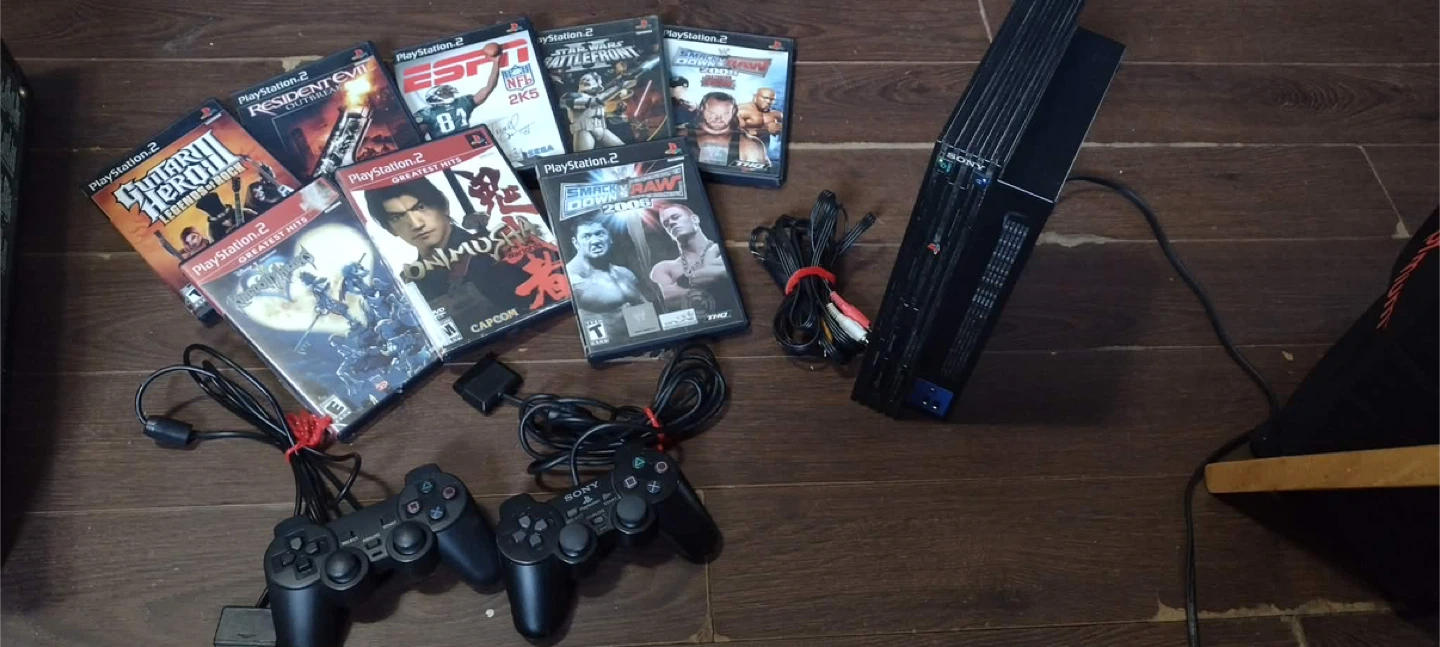 Sony PlayStation 2 Console with Games and Controllers
