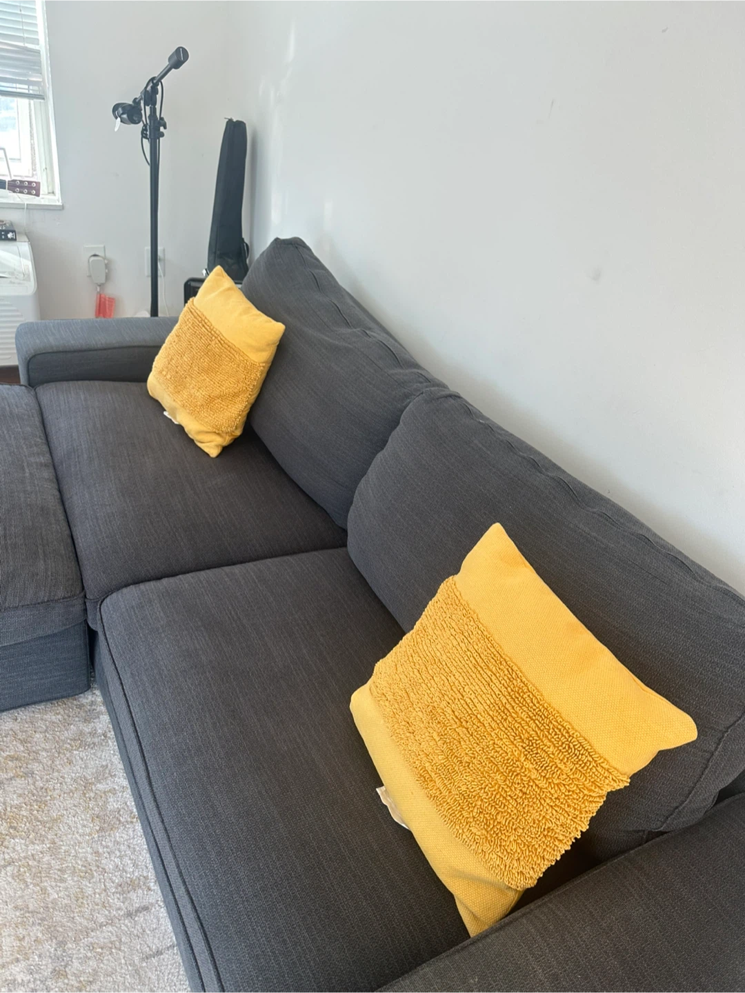 Dark Gray Ikea Sectional Sofa with Chaise and Yellow Pillows - photo 3
