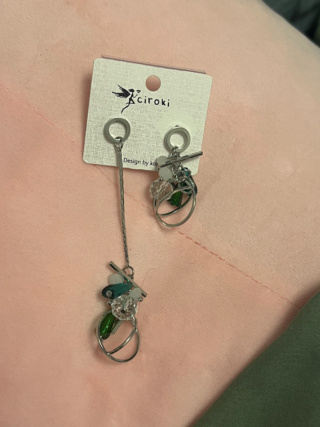 Asymmetrical earrings, green beads and stainless steel