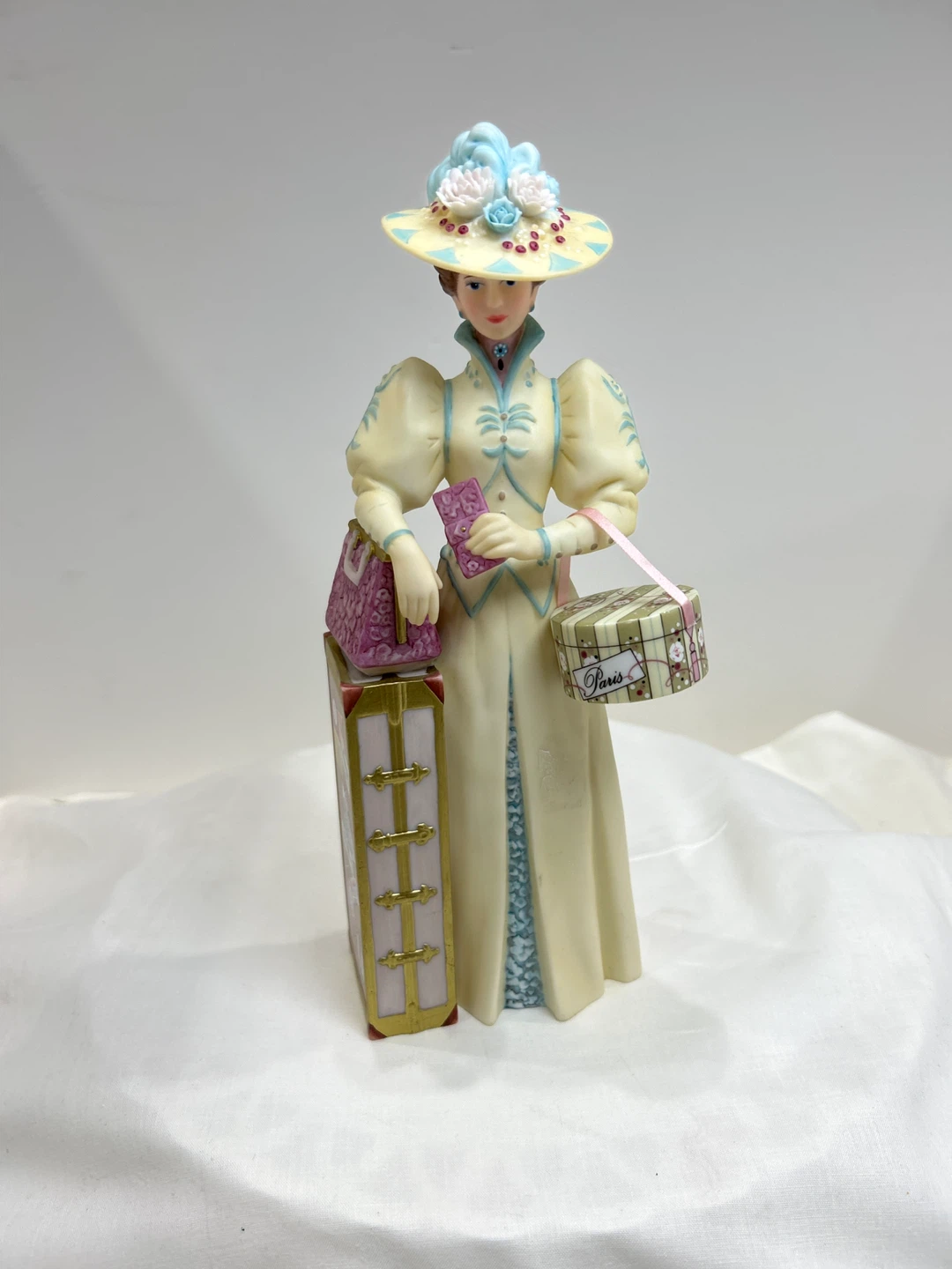 Vintage 2002 Avon  Mrs Albee award Lady with Luggage Figurine