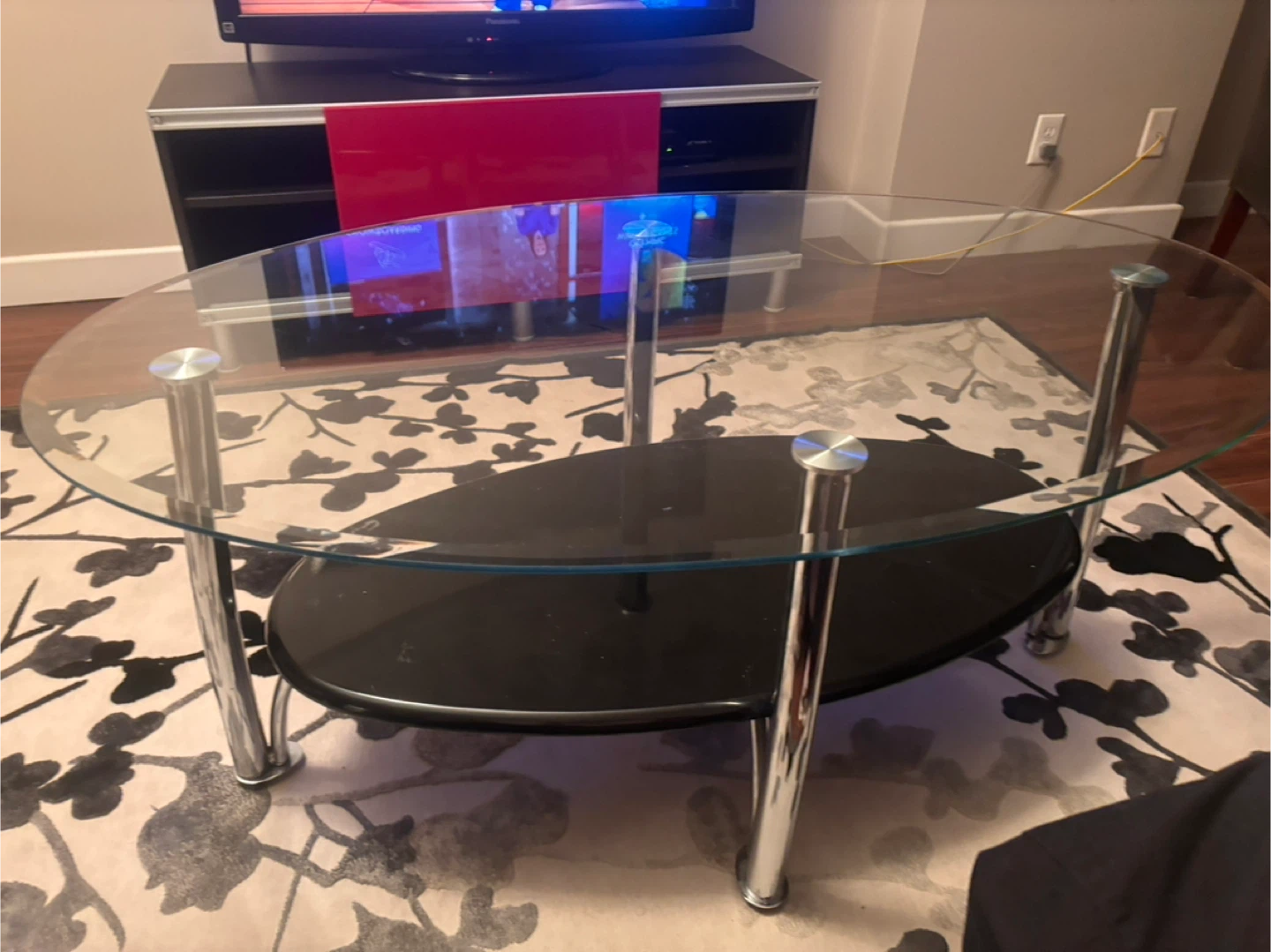 Oval Glass Coffee Table with Black Shelf