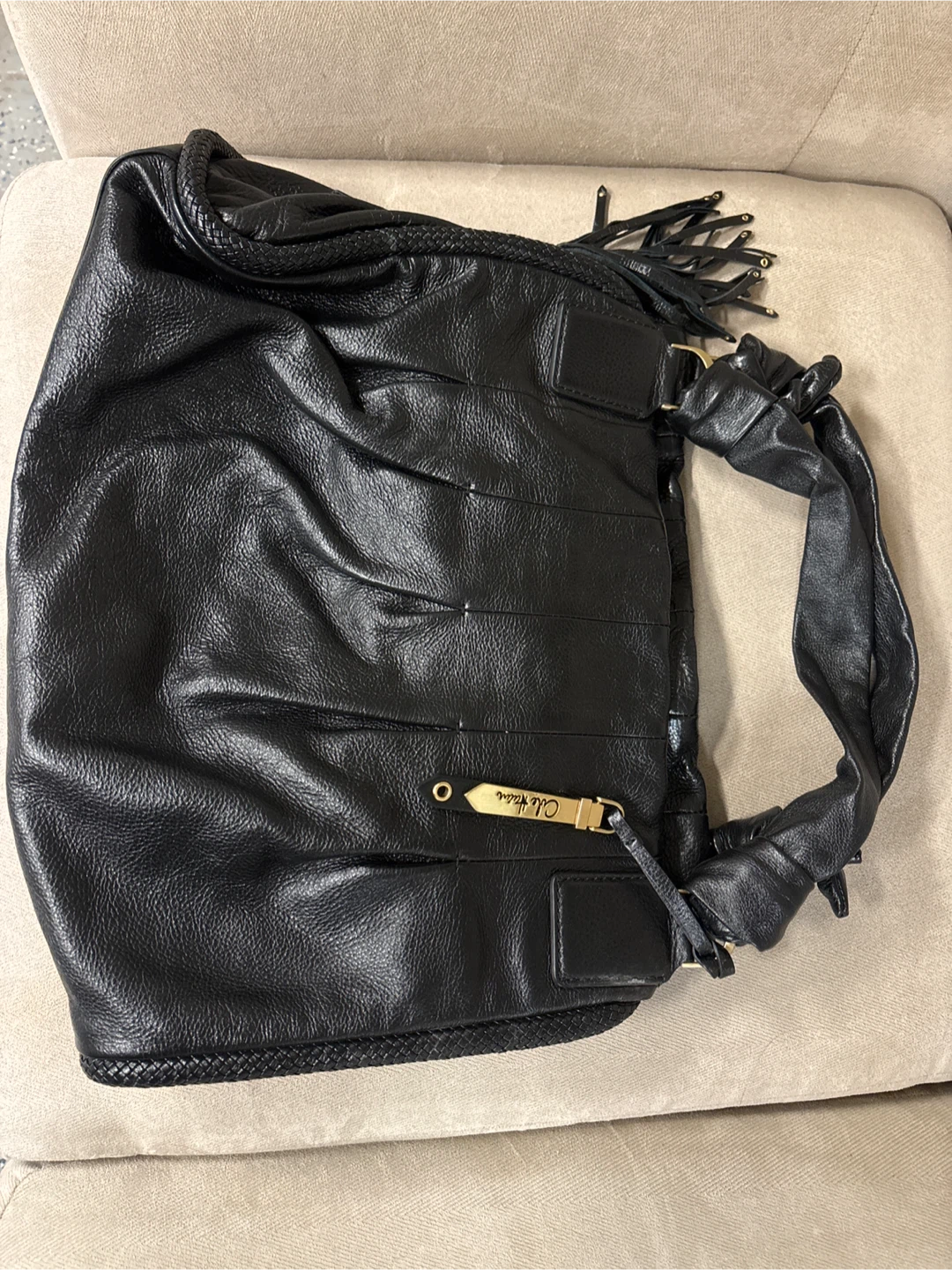 Cole Haan Black Leather Hobo Handbag with Tassel Detail