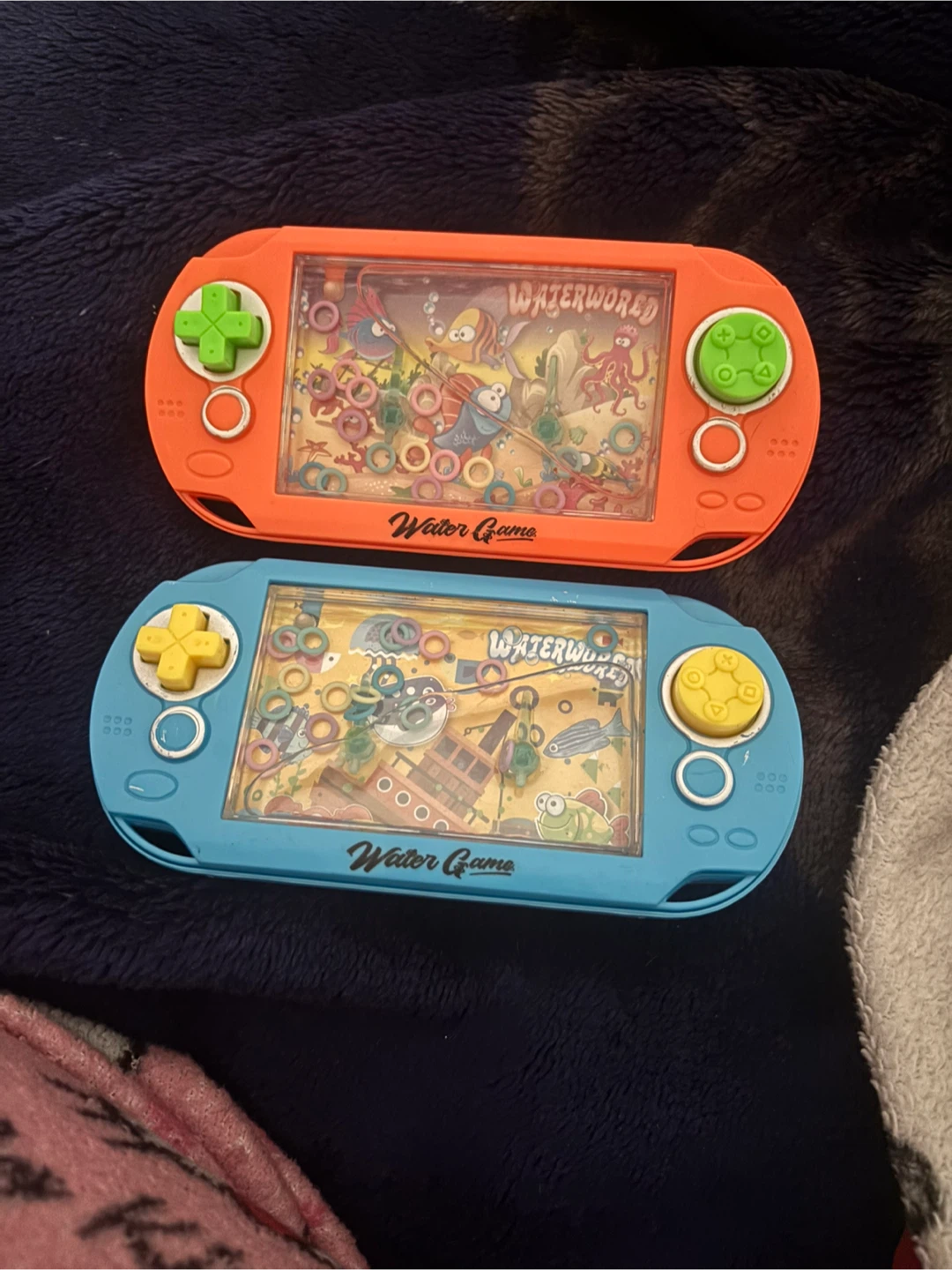 Waterworld Water Game Handheld Toy - Orange and Blue