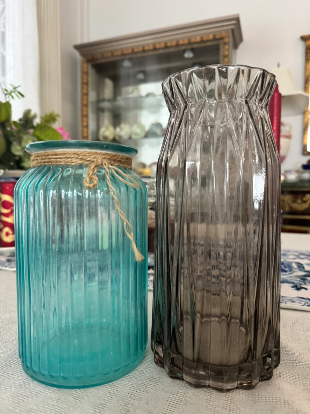 Two glass vases, teal and grey