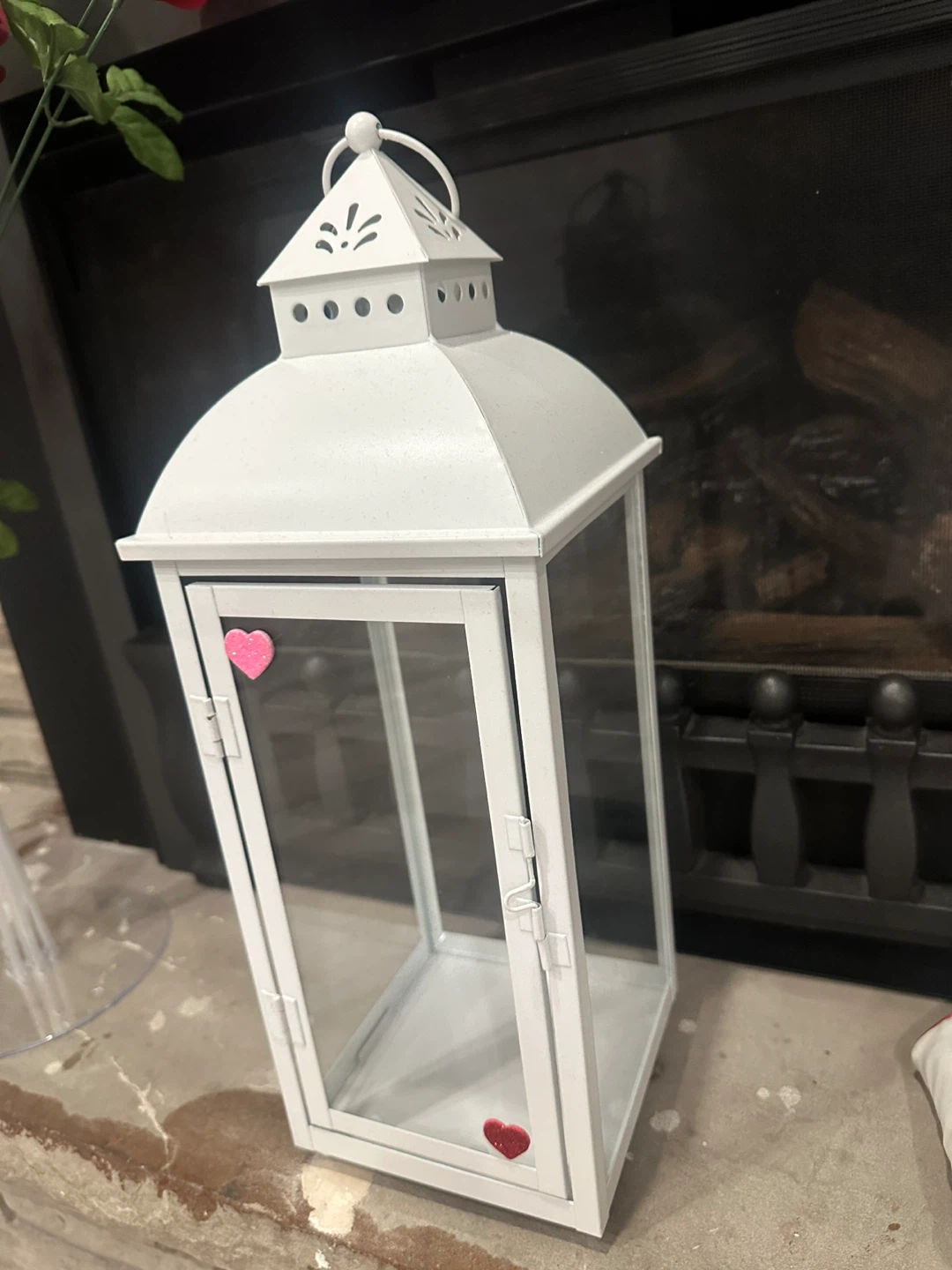 White decorative lantern with heart accents