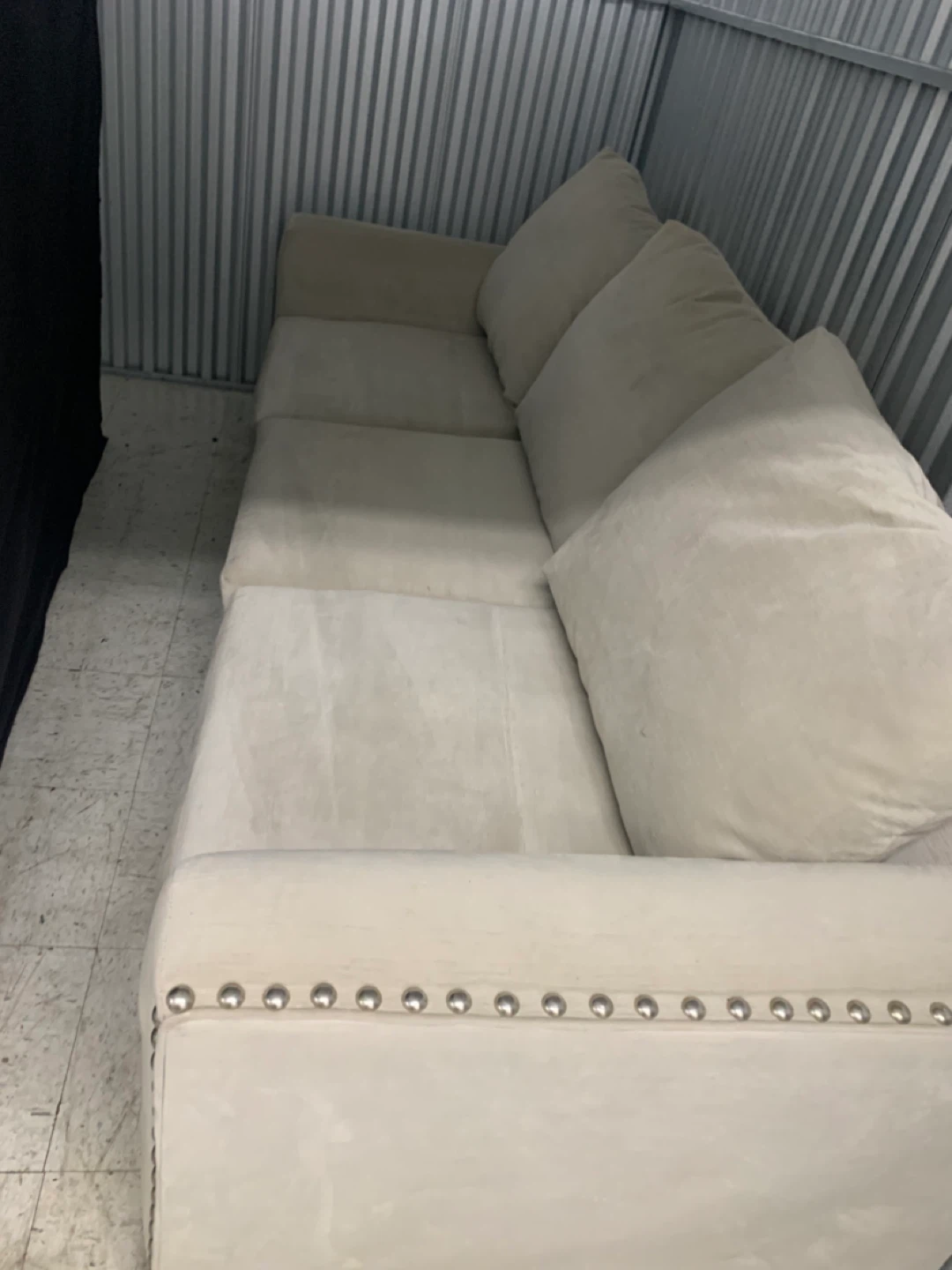 Cream Upholstered Sectional Sofa with Nailhead Trim