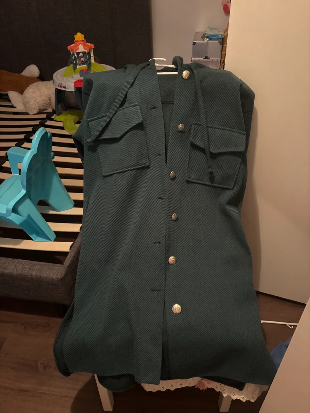 Green hooded jacket with button closure