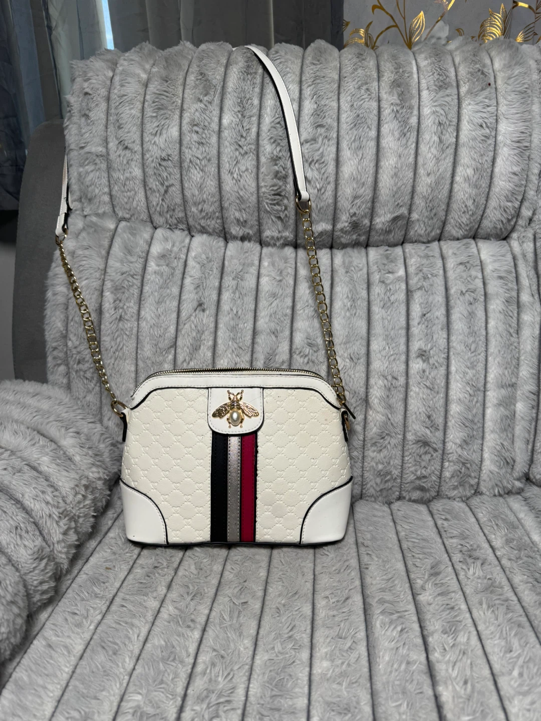 White crossbody bag with bee embellishment
