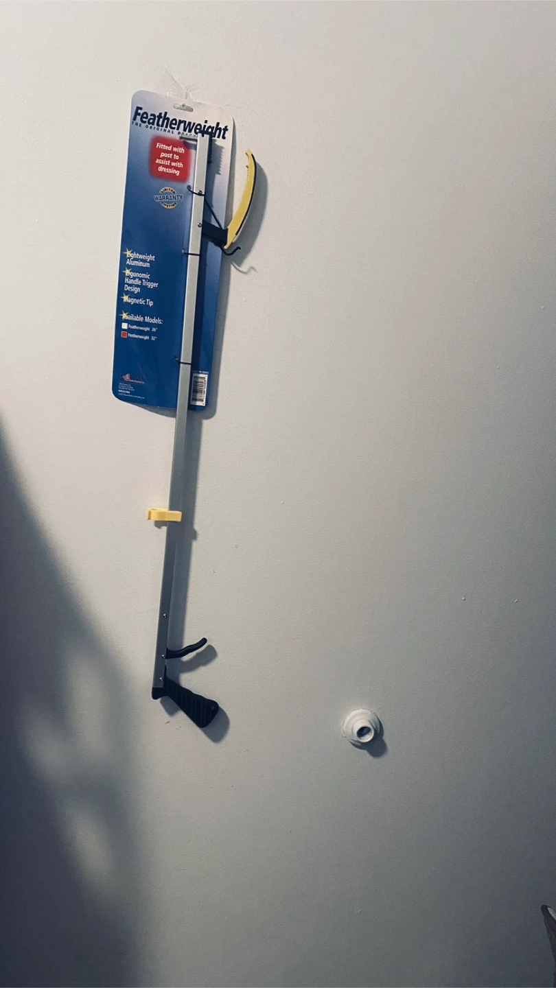 Long handled dressing aid tool