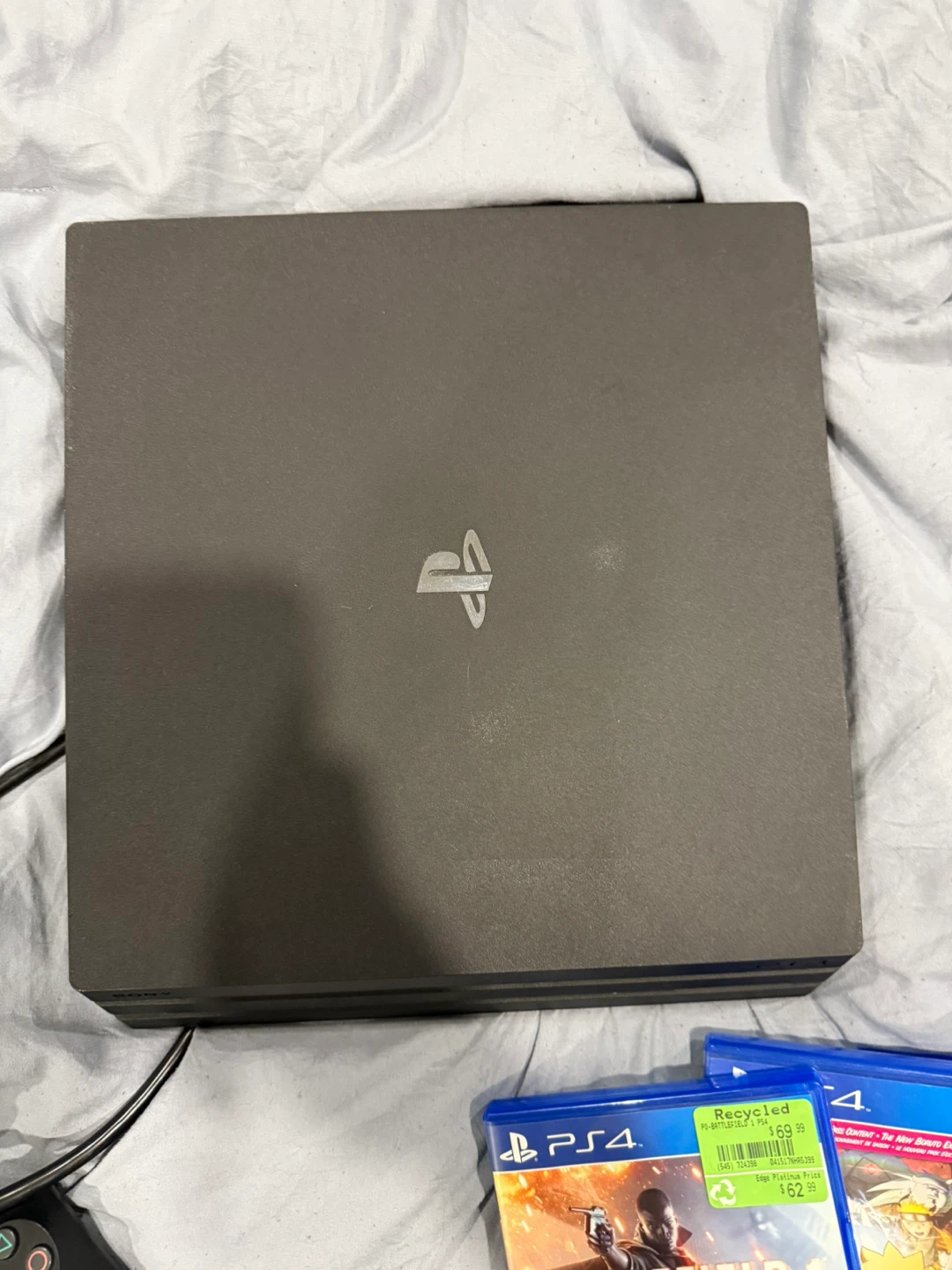 Sony PlayStation 4 Pro Console with Controller and Games