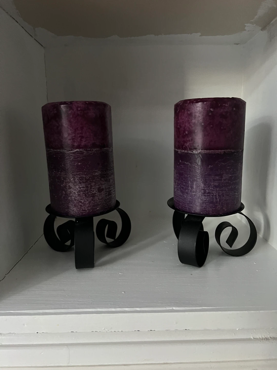 Pair of Purple Pillar Candles on Black Metal Holders