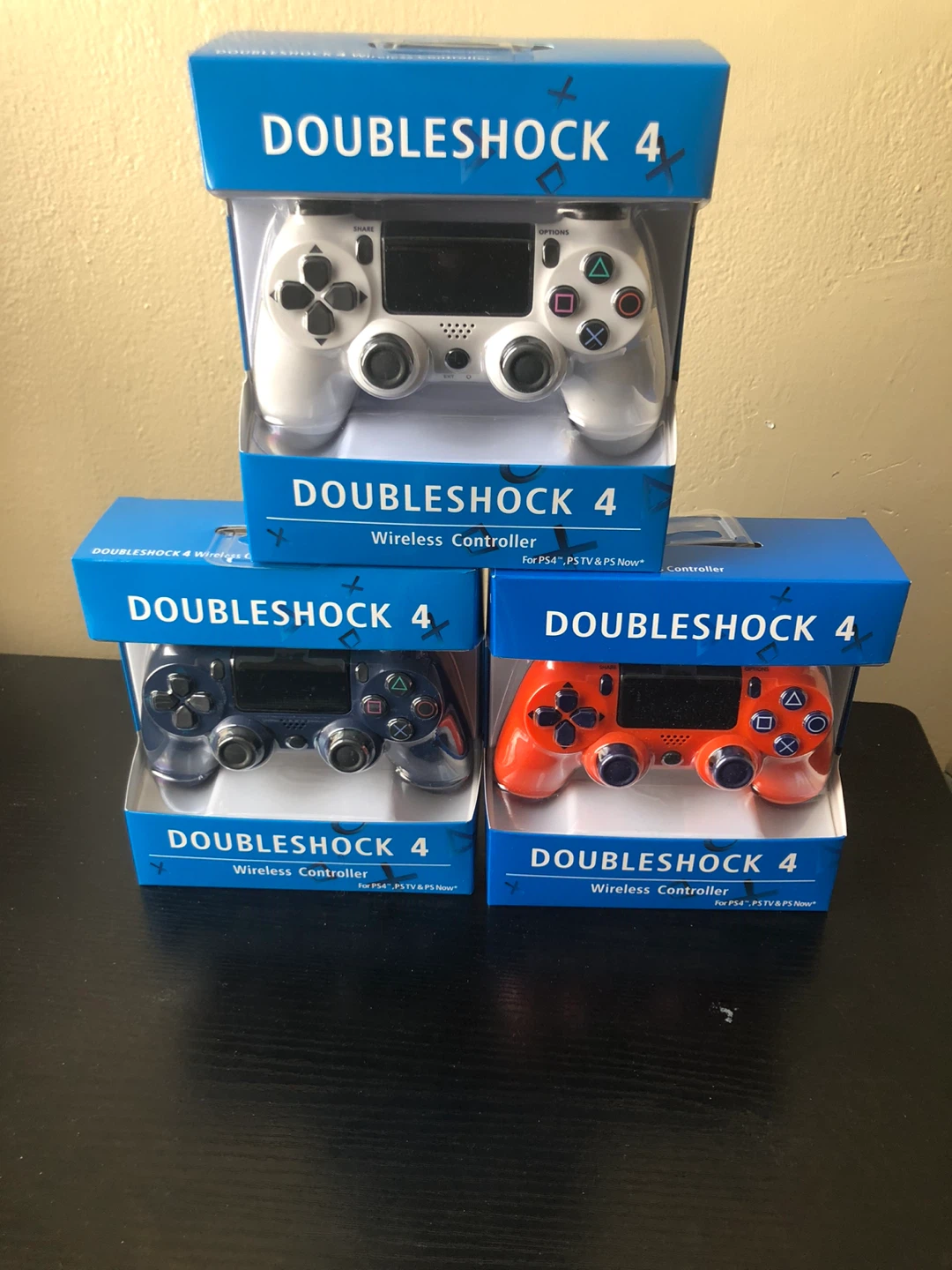 DoubleShock 4 Wireless Controllers (White, Blue, Orange)