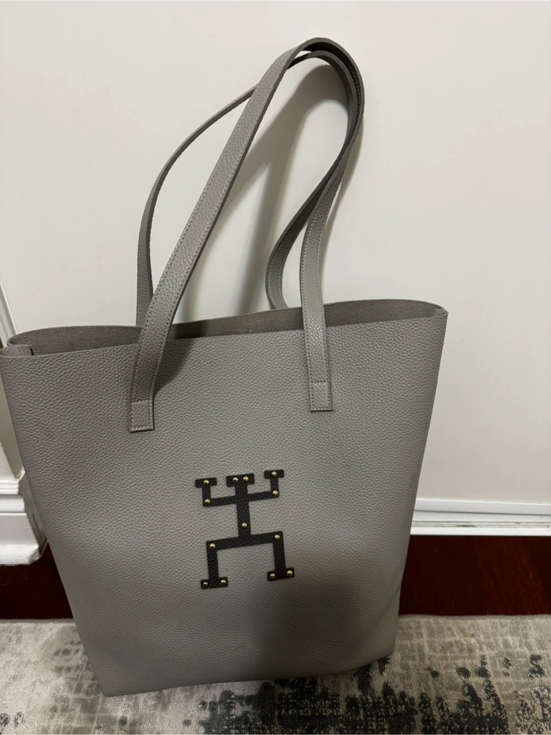 Grey Faux Leather Tote Bag with Decorative Emblem