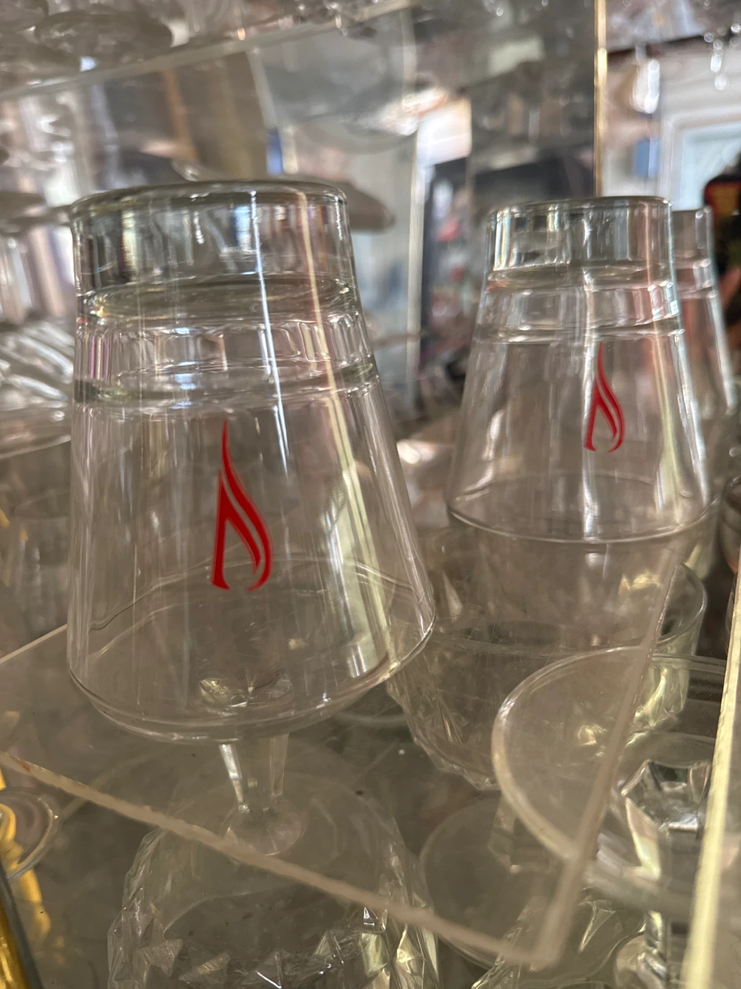Set of 2 clear glass tumblers with red flame logo