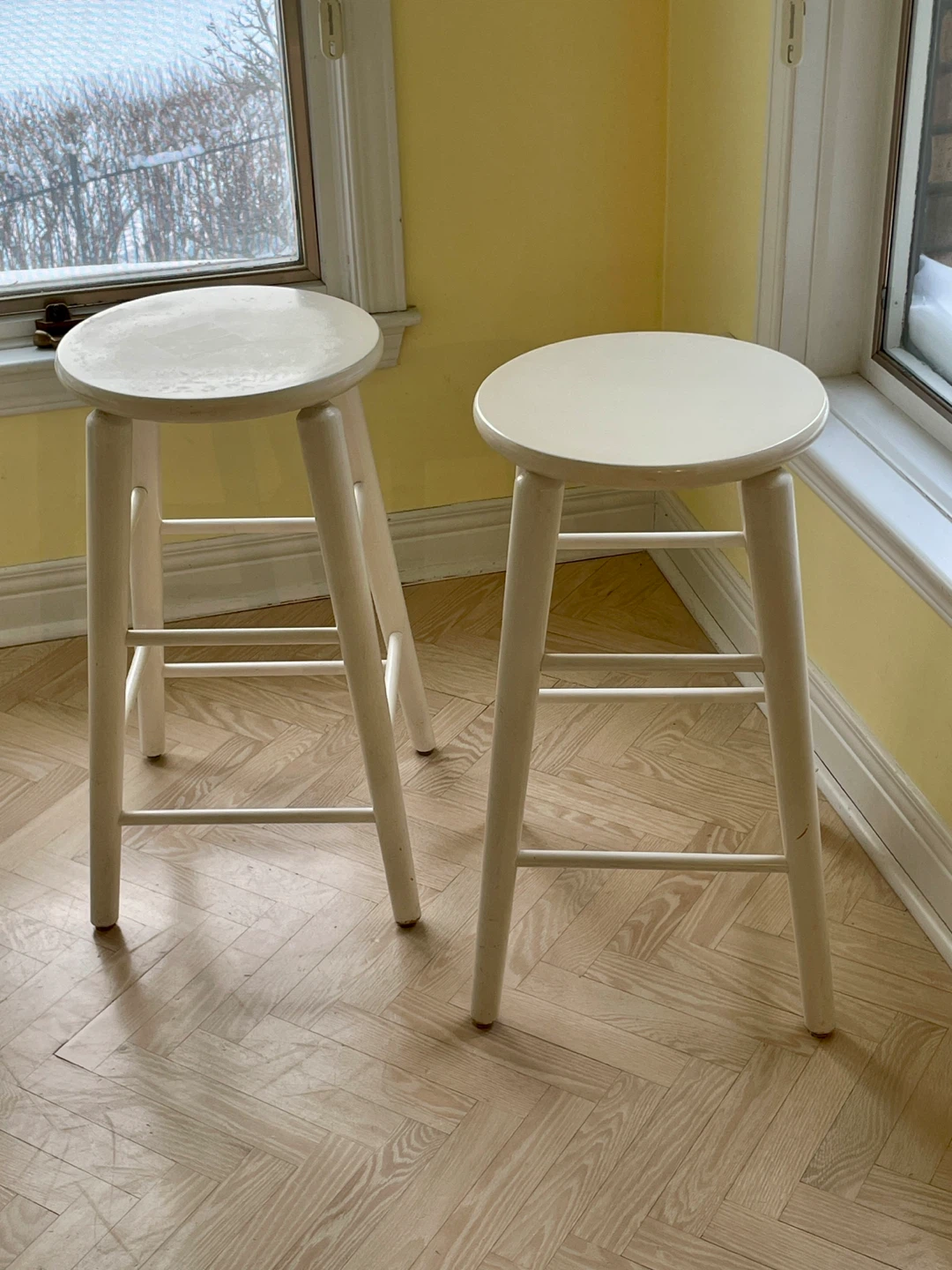 Pair of white bar stools with removable blue gingham cushions