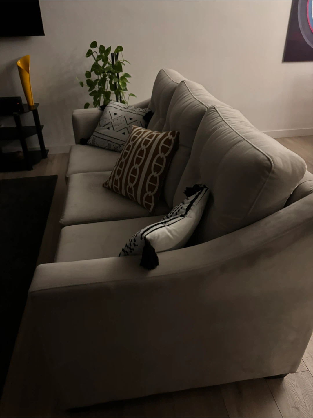 Light Grey Tufted Sofa with Decorative Pillows