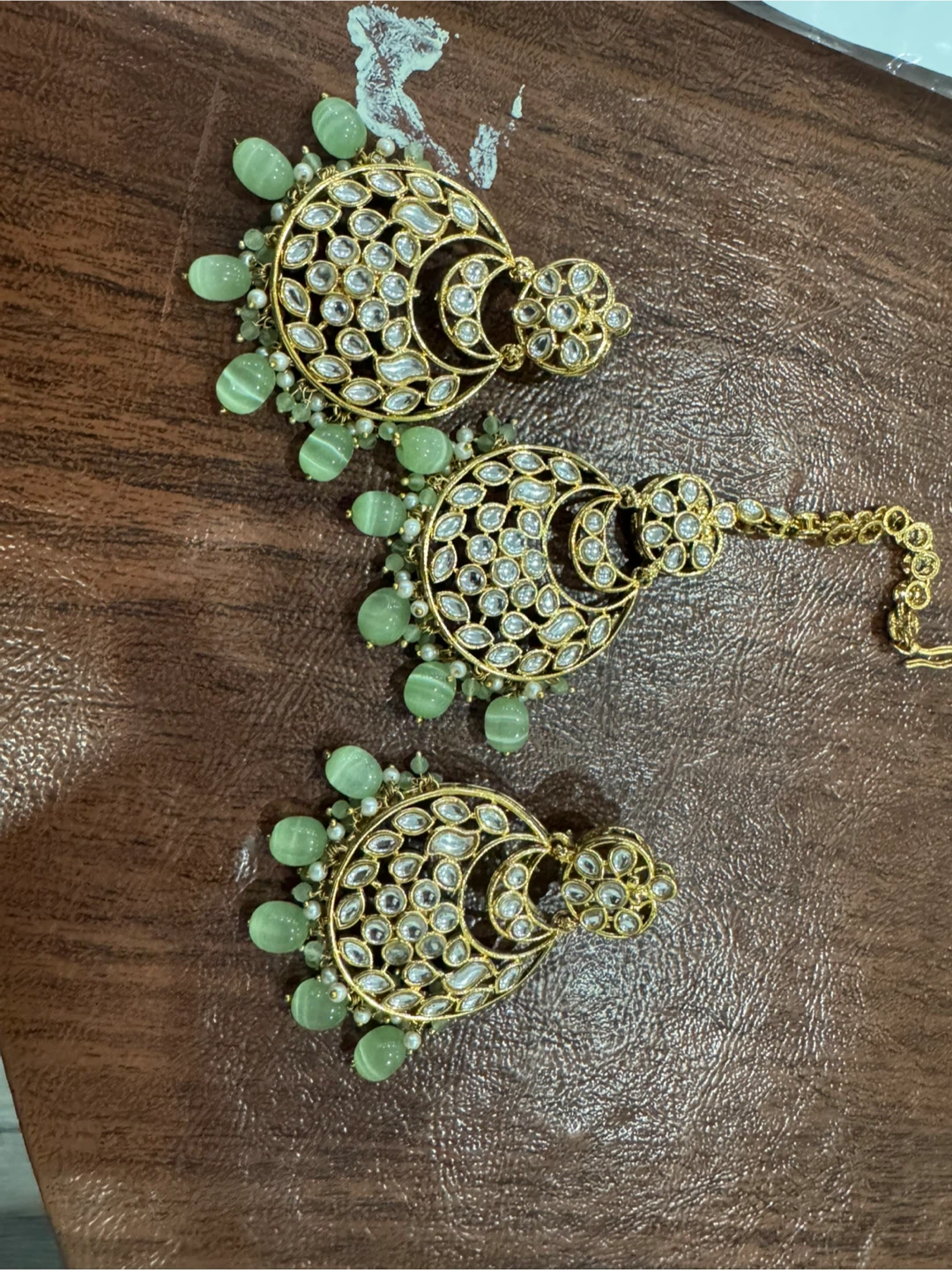 Gold Tone Kundan Earrings and Tikka Set with Green Beads