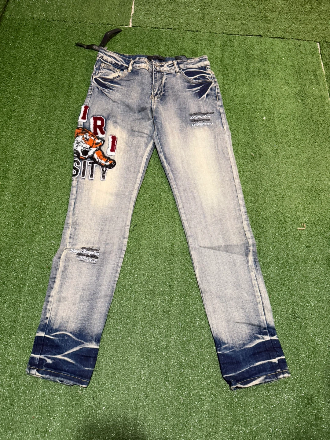 Amiri American Varsity Jeans with Tiger Patch