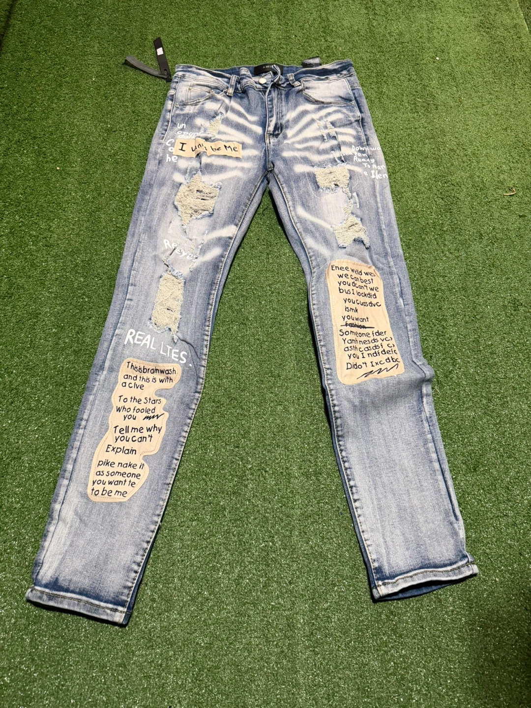 Amiri Distressed Graphic Jeans