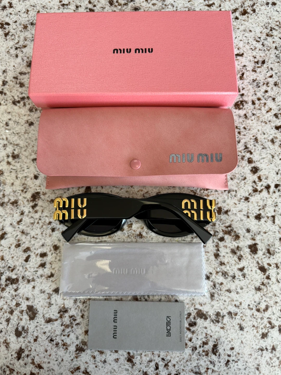 Miu Miu Black Oval Sunglasses with Gold Logo Detail - photo 2