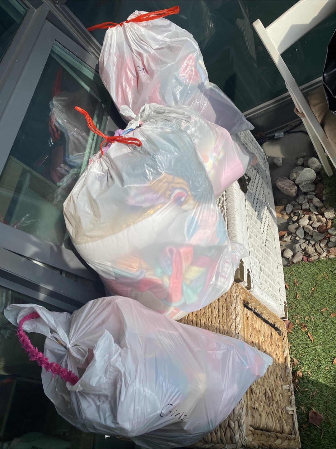 Four bags of girls, clothing, blankets, toys, and more