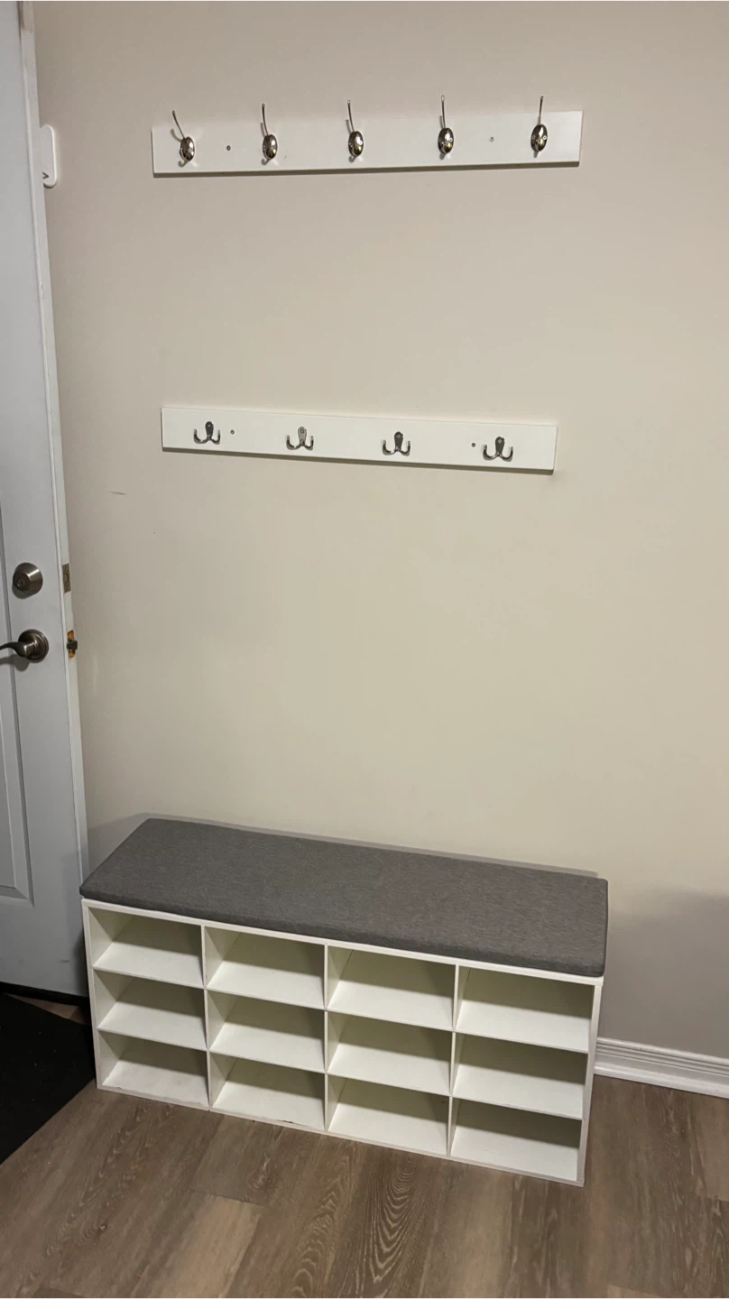 White shoe bench with 12 cubbies and grey cushion