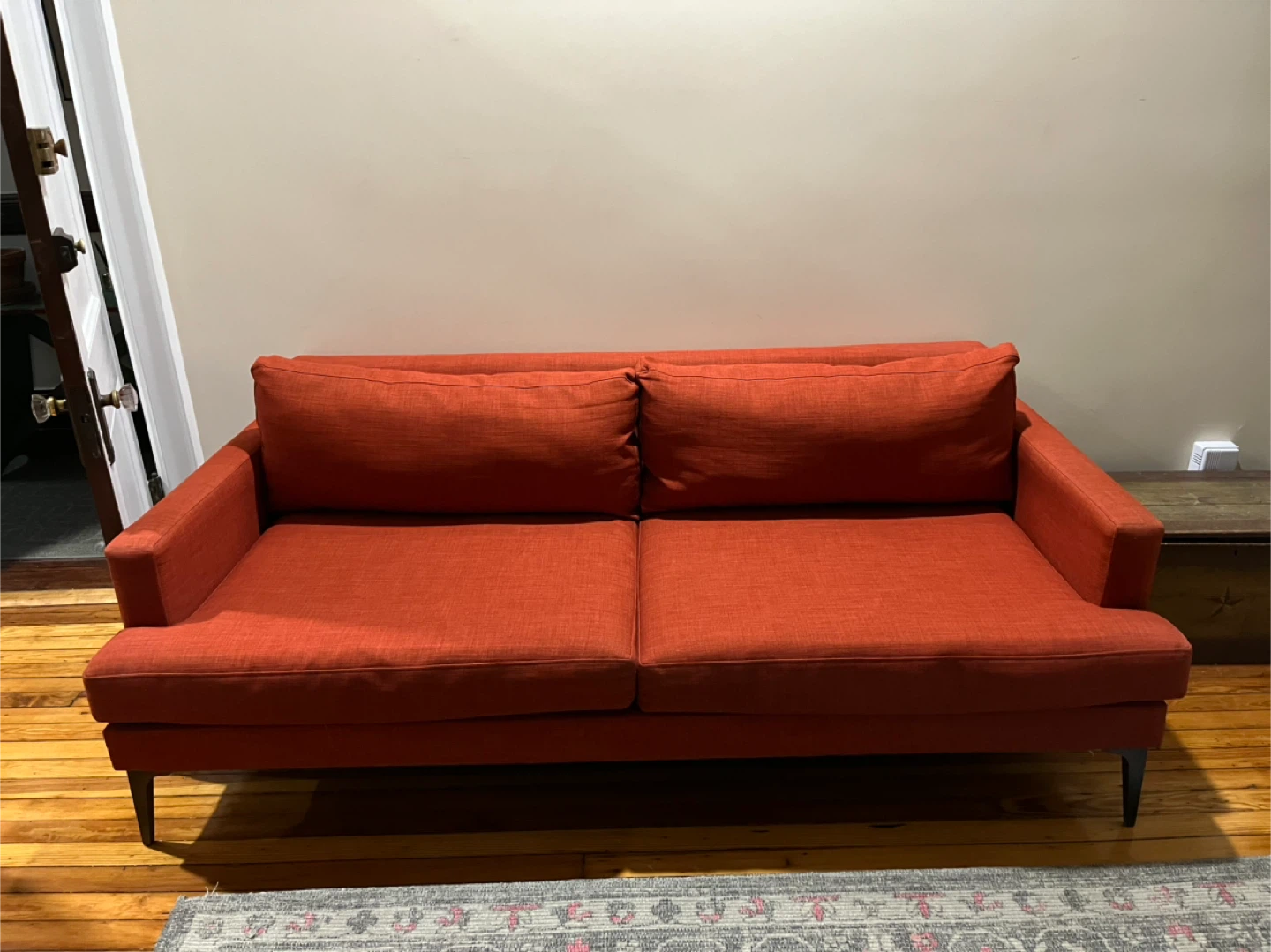Orange Sofa with Two Cushions