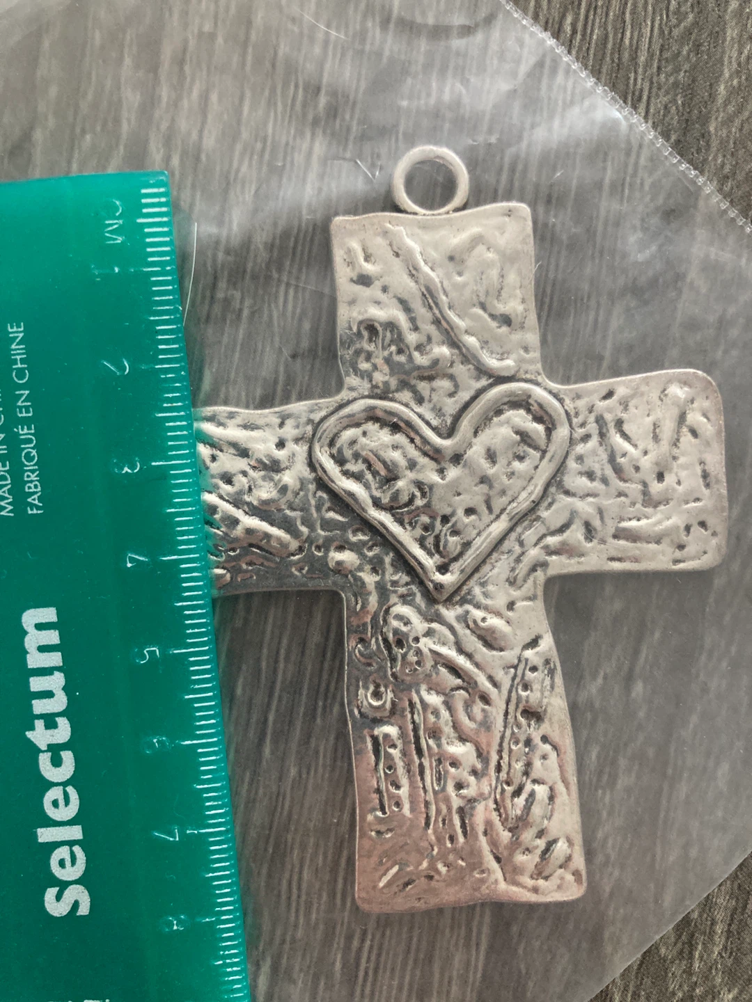 Silver Metal cross pendant with heart detail