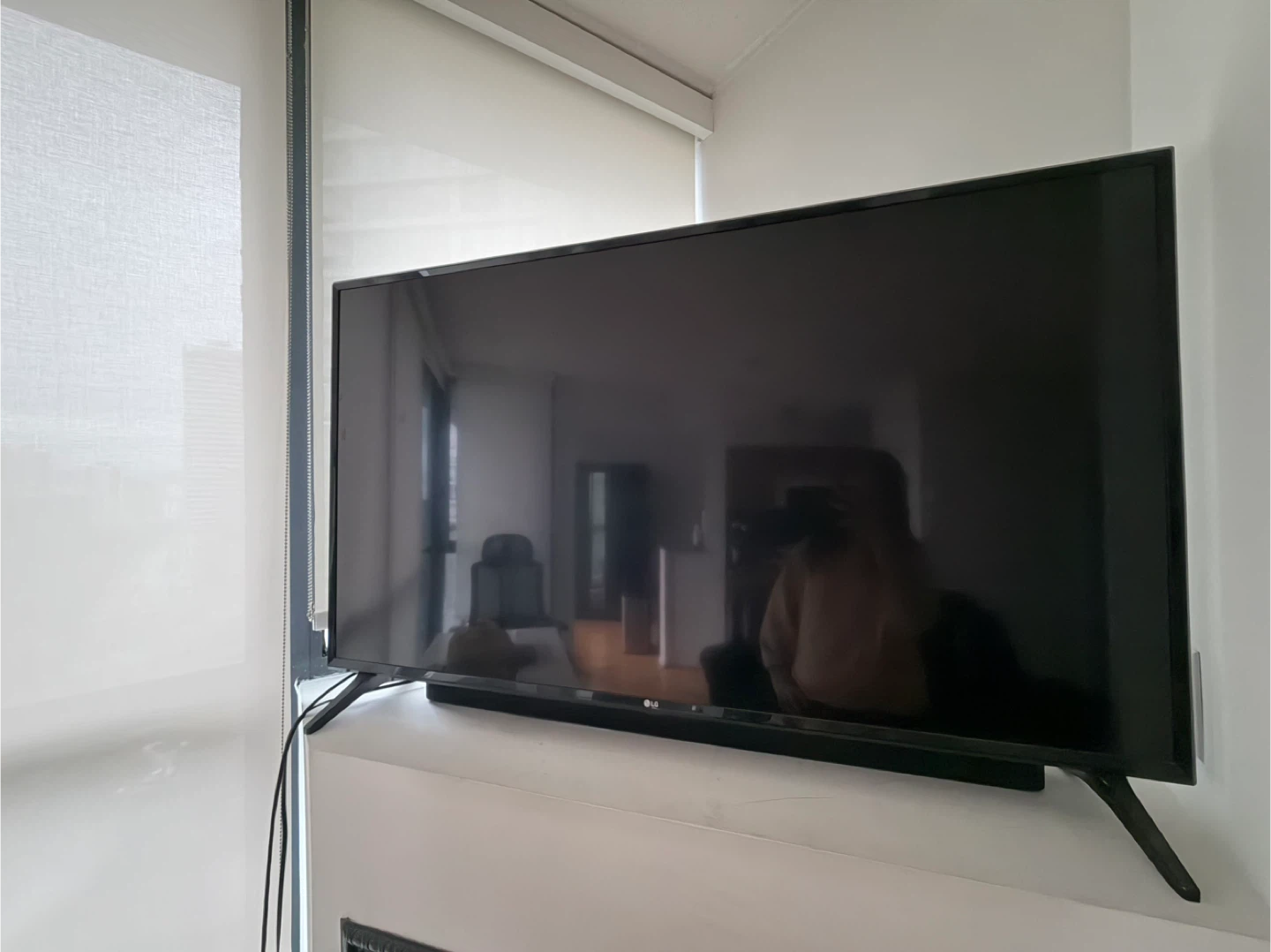 LG Television and Black Subwoofer Speaker