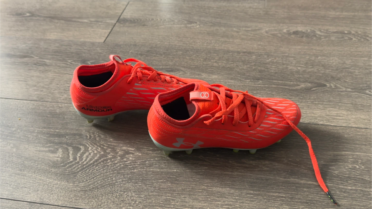 Kids Under Armour Orange Football Cleats
