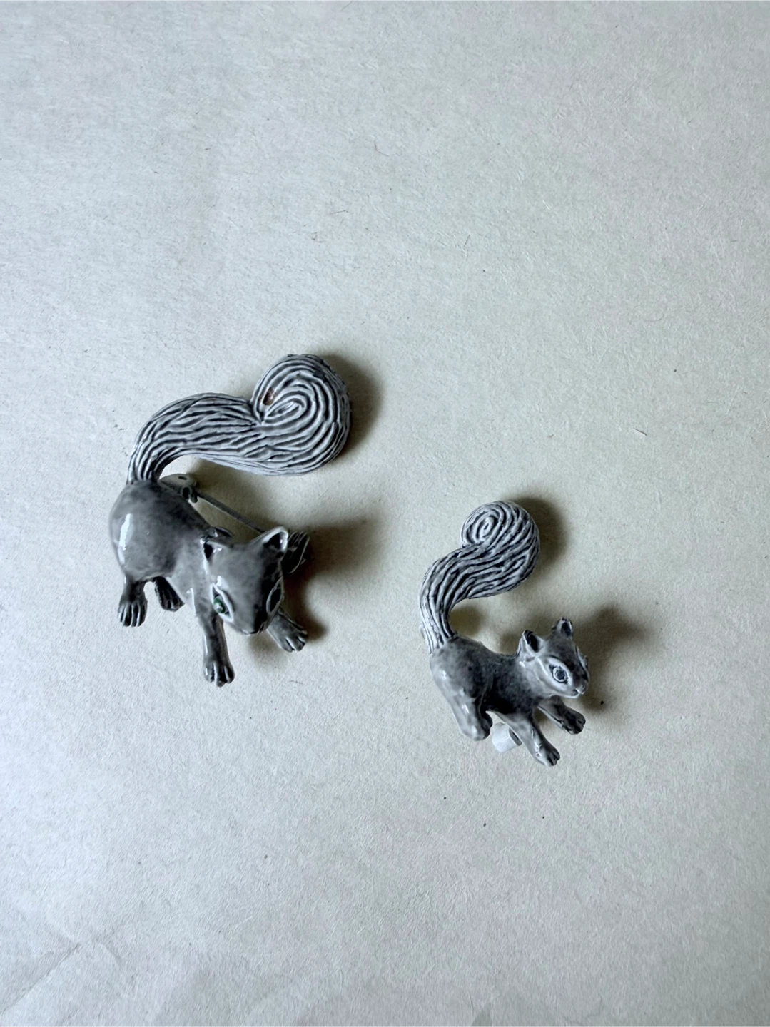 Two Ceramic Squirrel Brooches