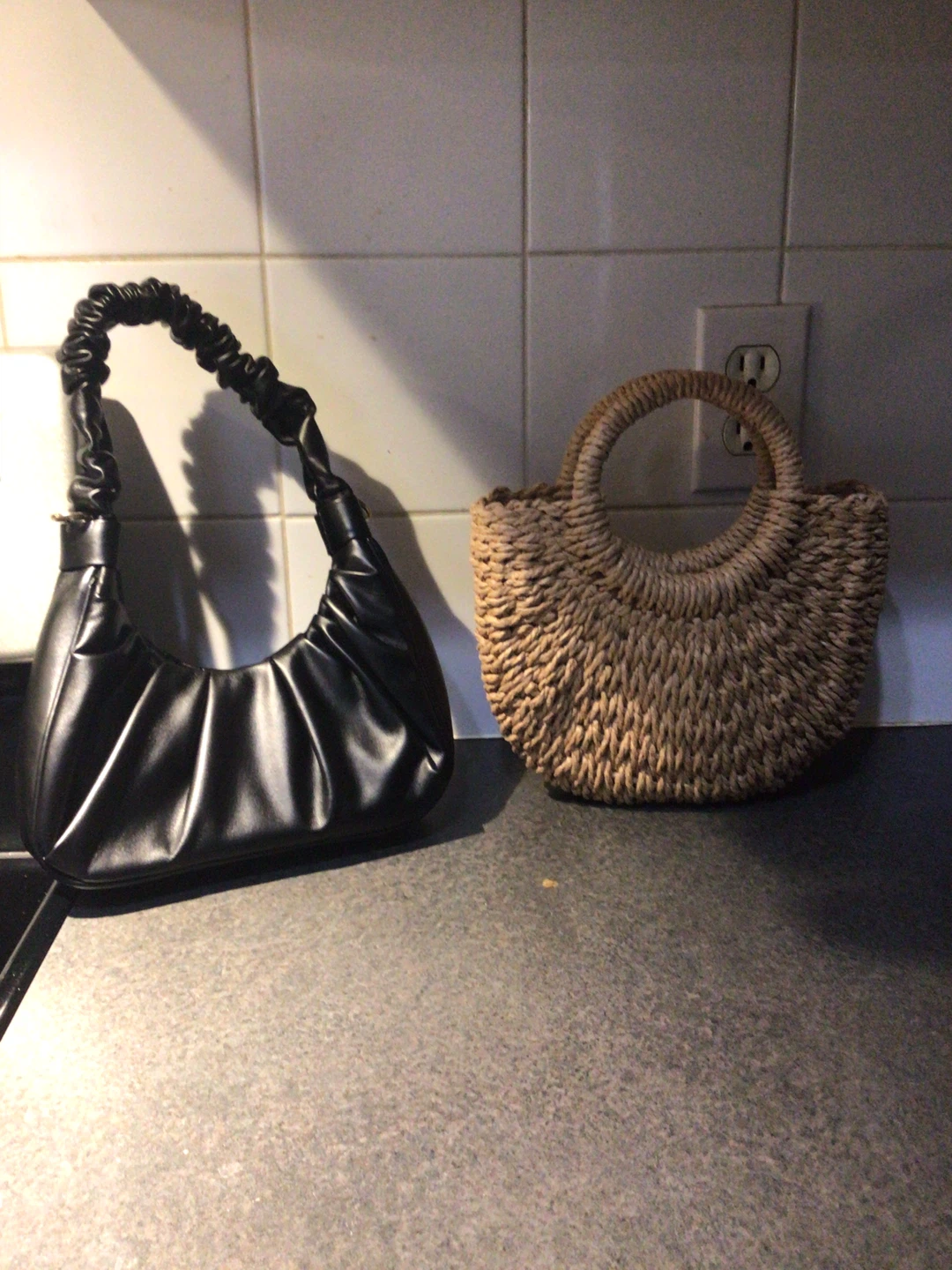 Black ruched shoulder bag and straw tote