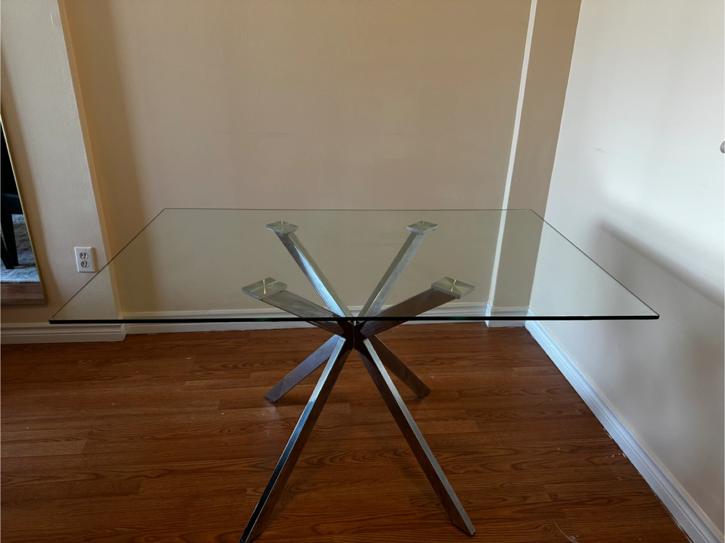 Glass top dining table with metal base