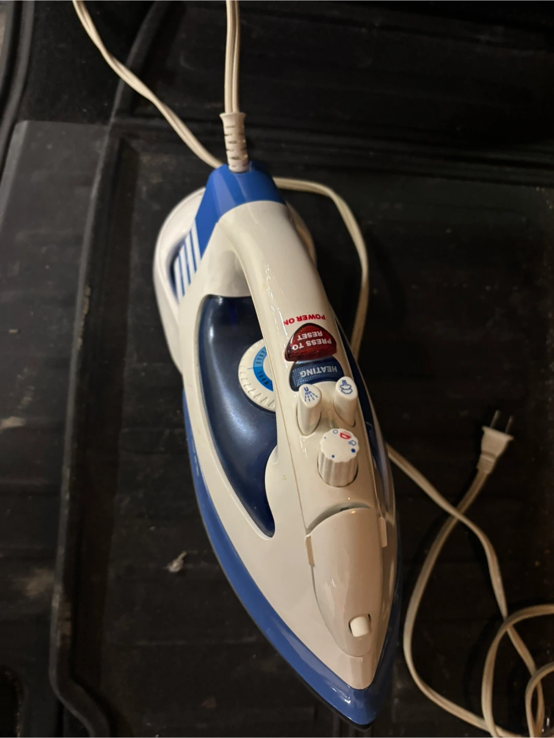 Used White and Blue Steam Iron