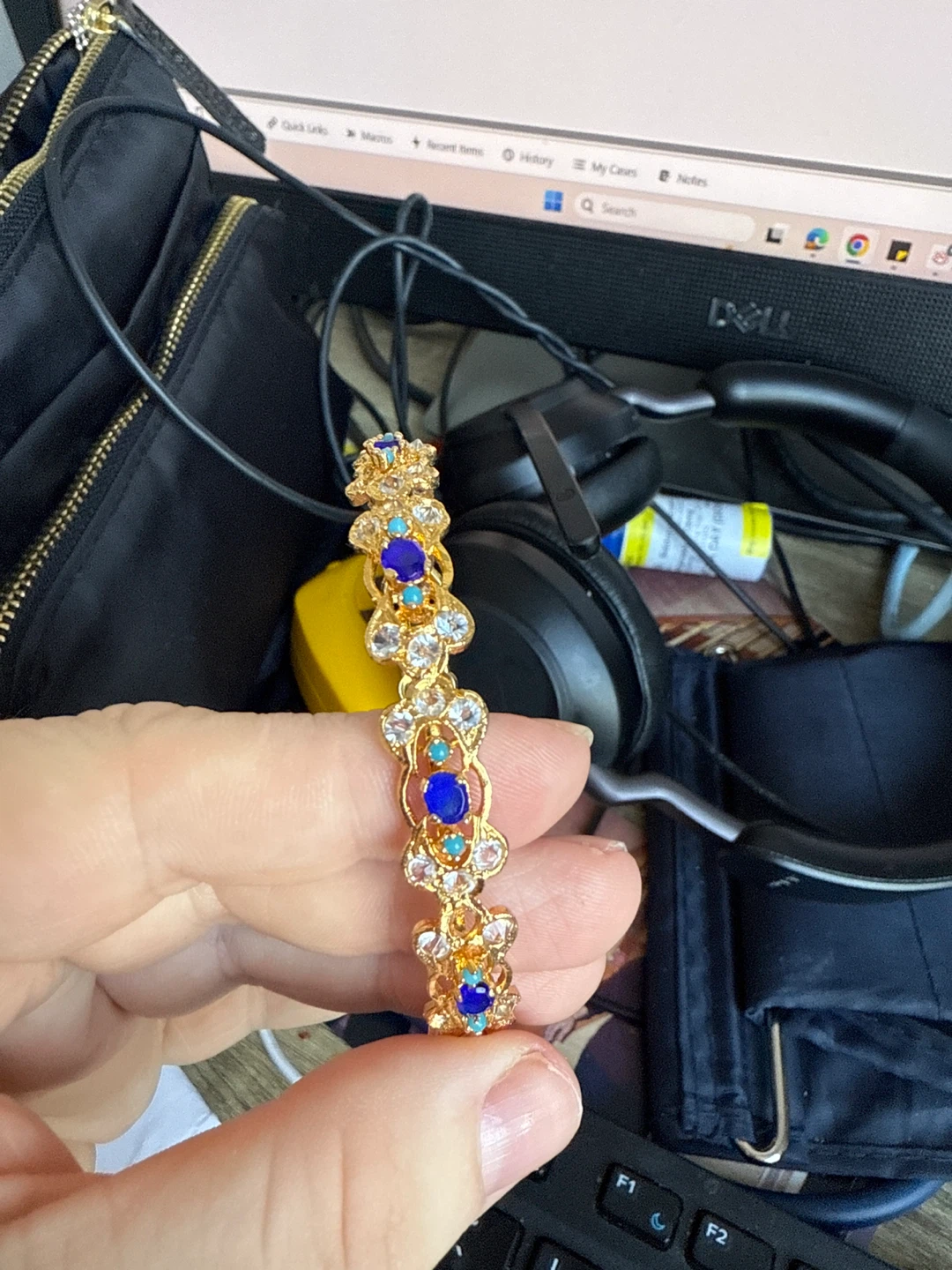 Gold-tone Bangle Bracelet with Blue and Clear Stones