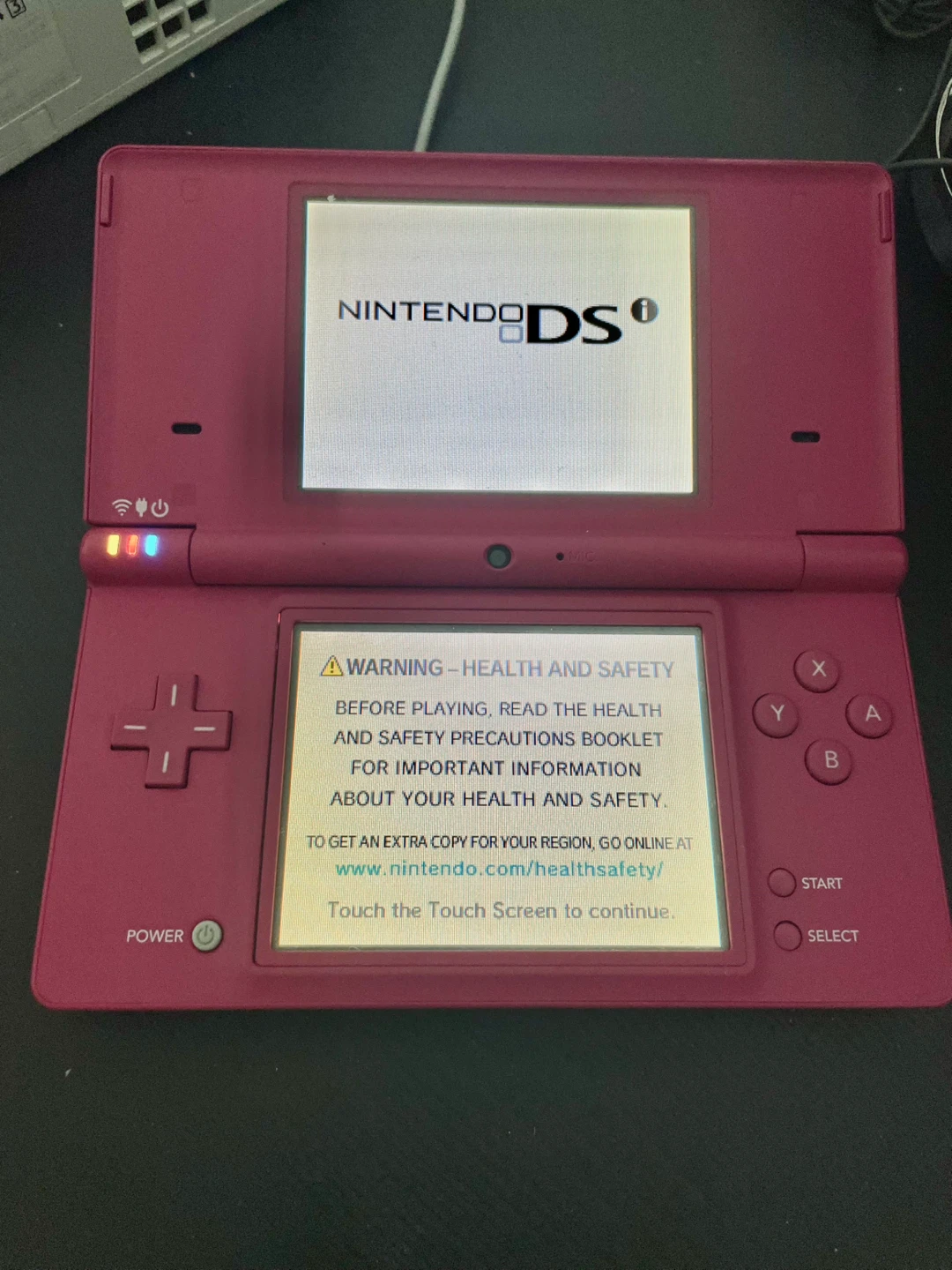 Nintendo DSi pink and two games