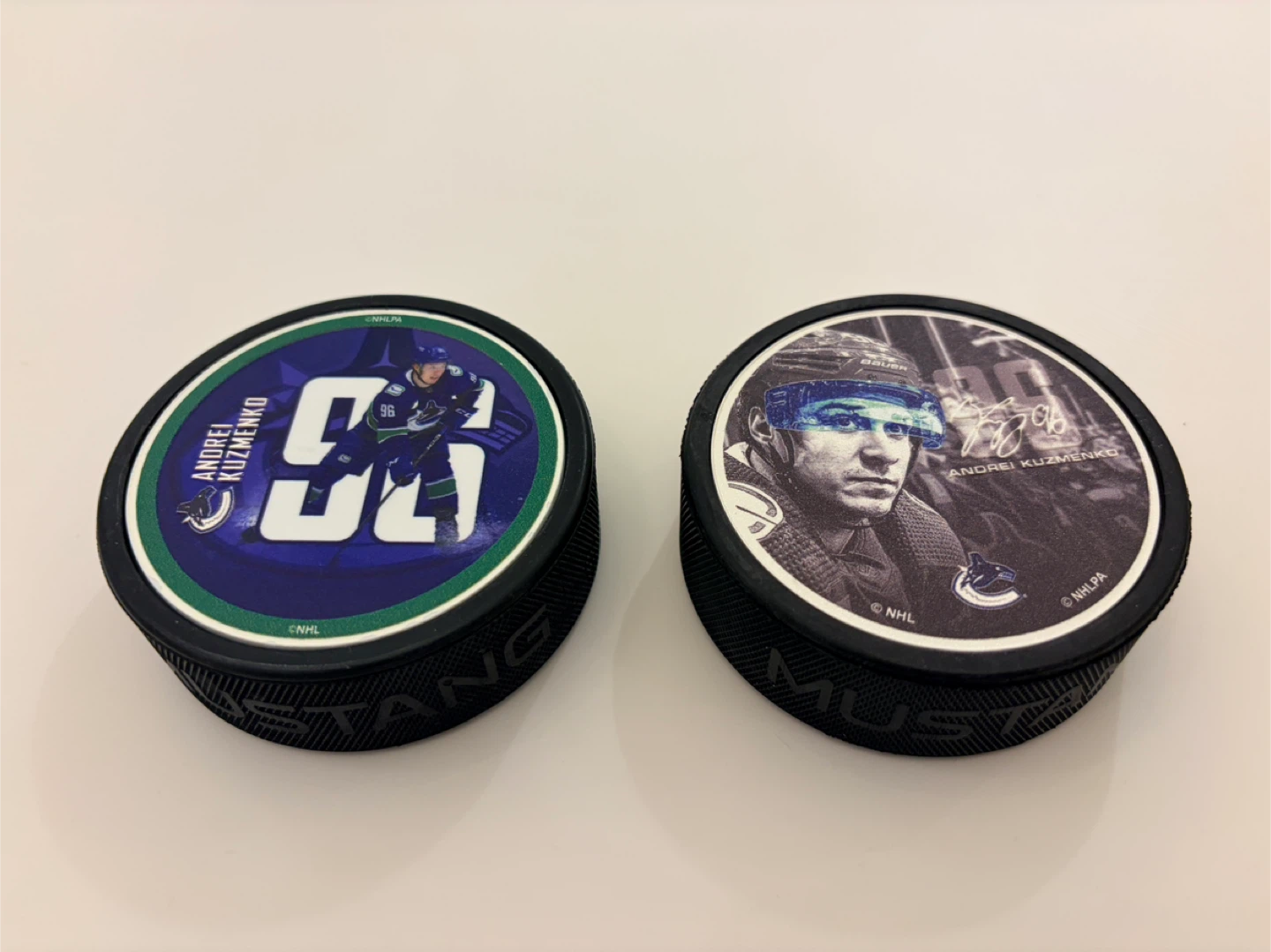 Official Vancouver Canucks Andrei Kuzmenko Player Hockey Pucks