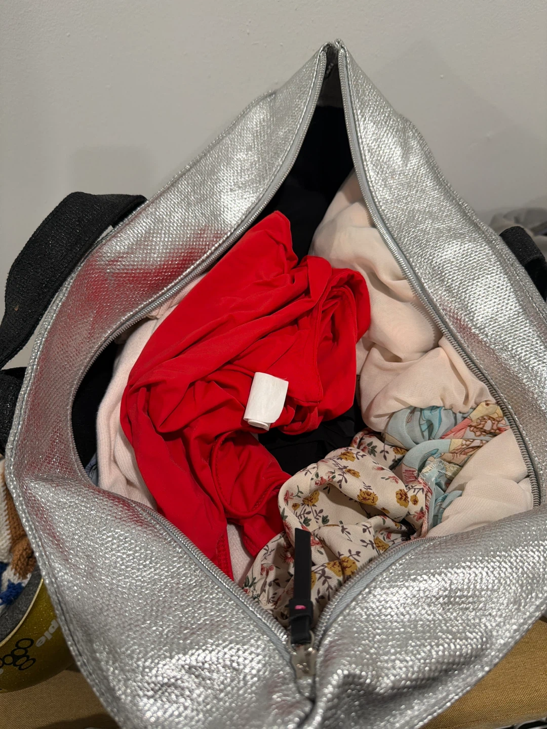 Silver Tote Bag Filled with Clothing