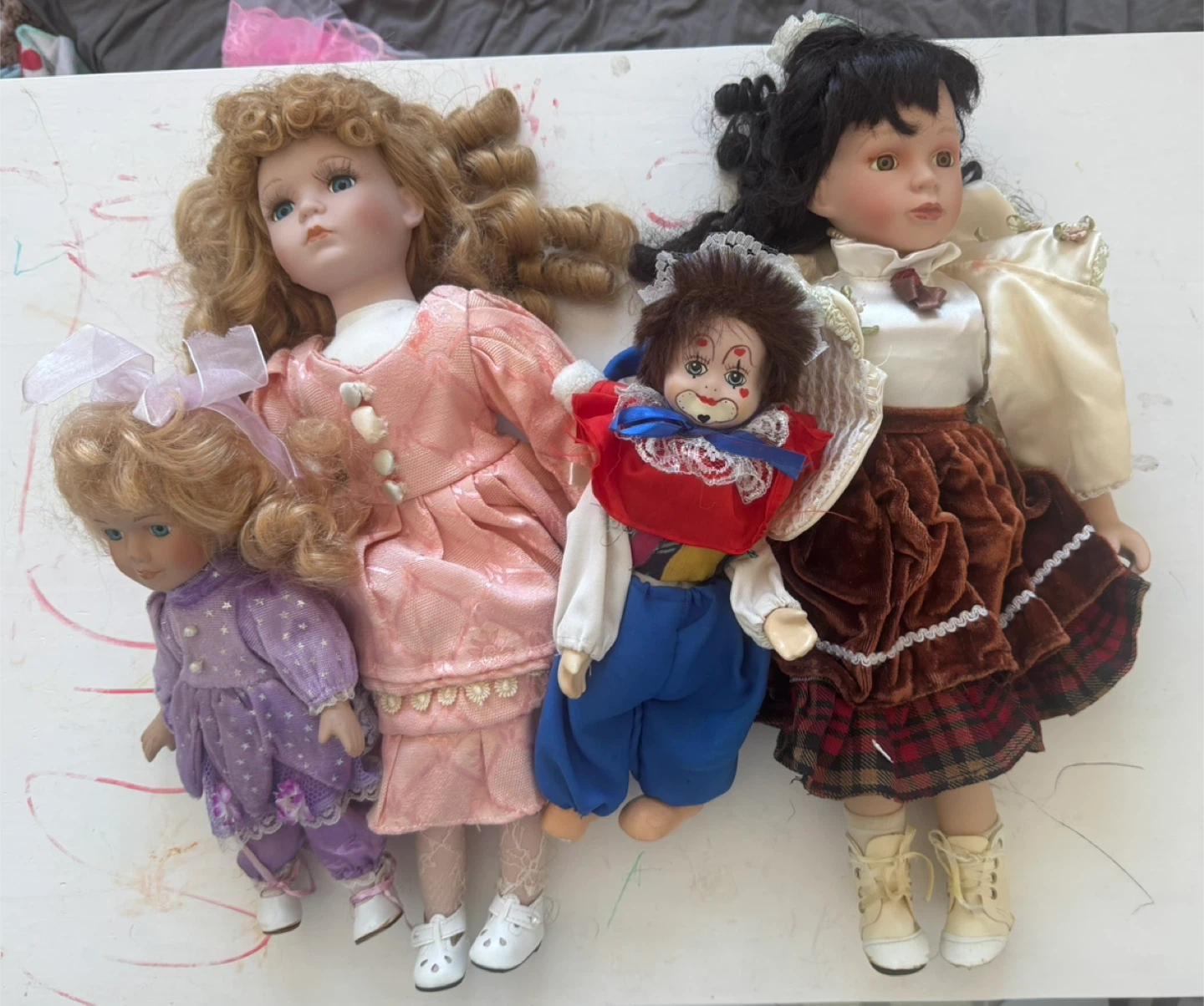 Collection of 4 Porcelain Dolls