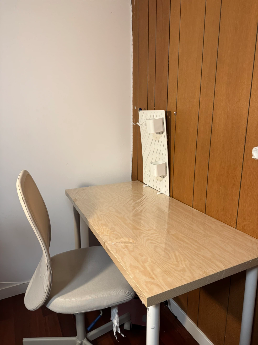 Wood grain desk with pegboard organizer