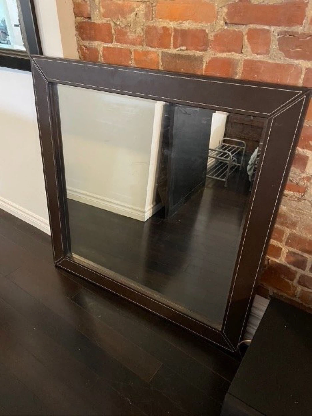 Pair (2) of 42" x 42" mirrors mounted in a leather frame