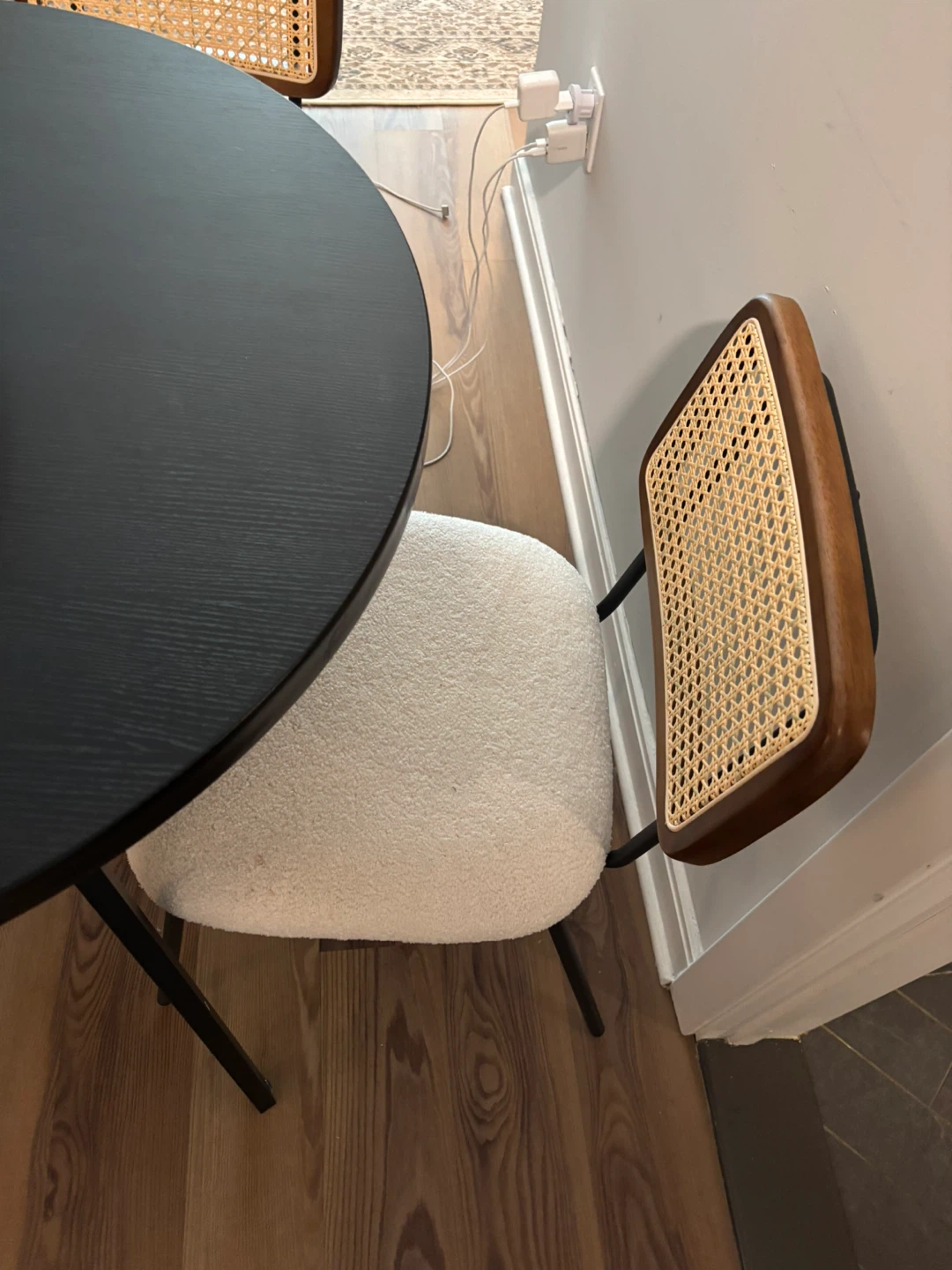 Set of rattan chairs with metal legs.
