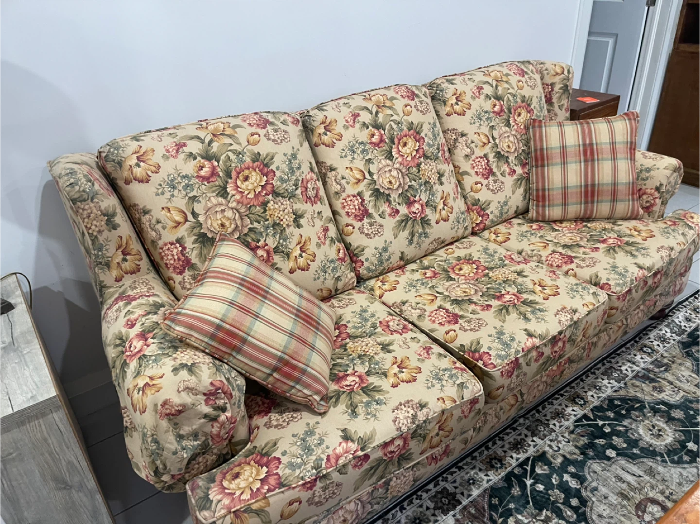 Floral pull out Sofa with Plaid Accent Pillows