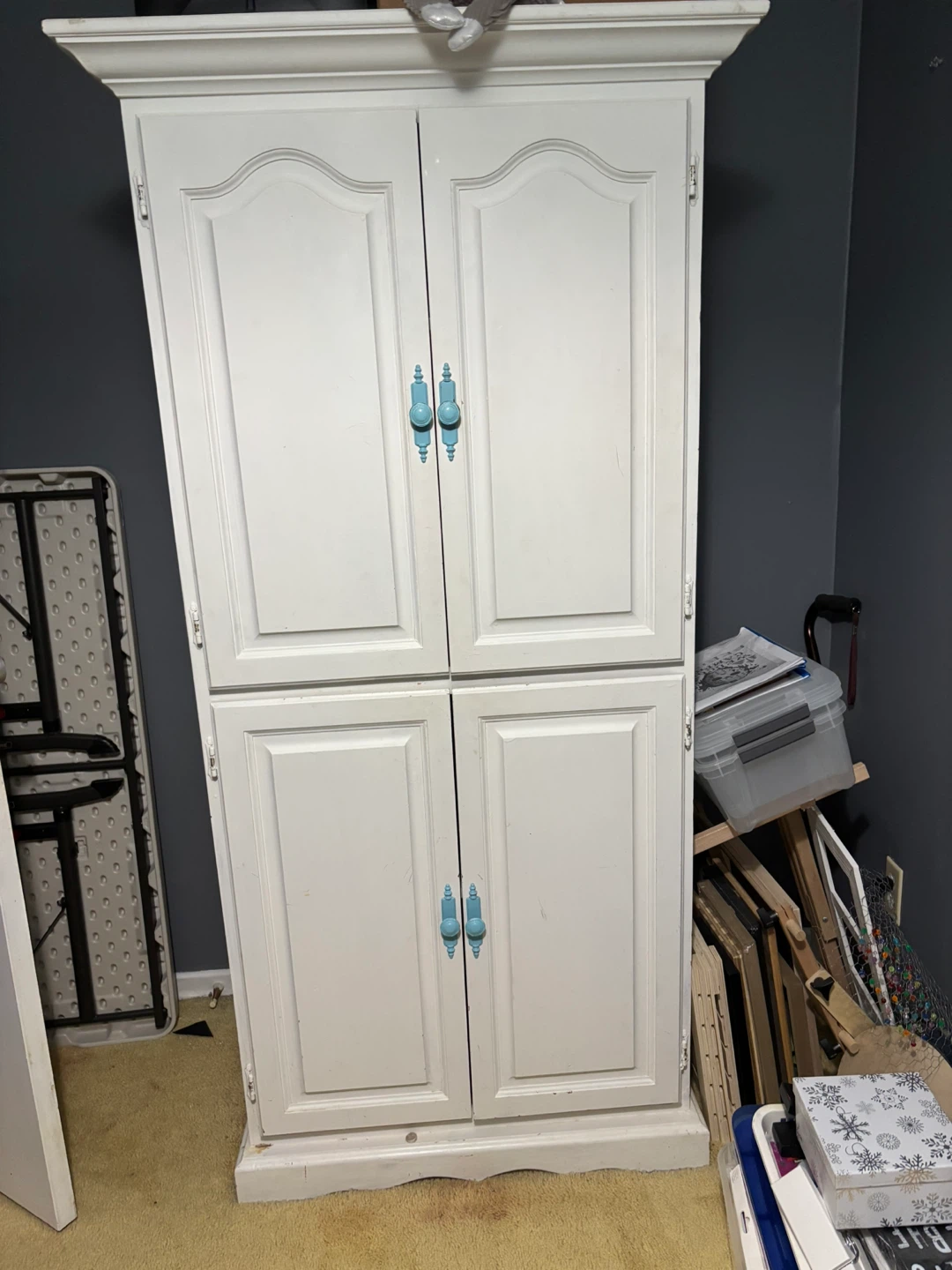 White Two-Door Storage Cabinet with Blue Handles
