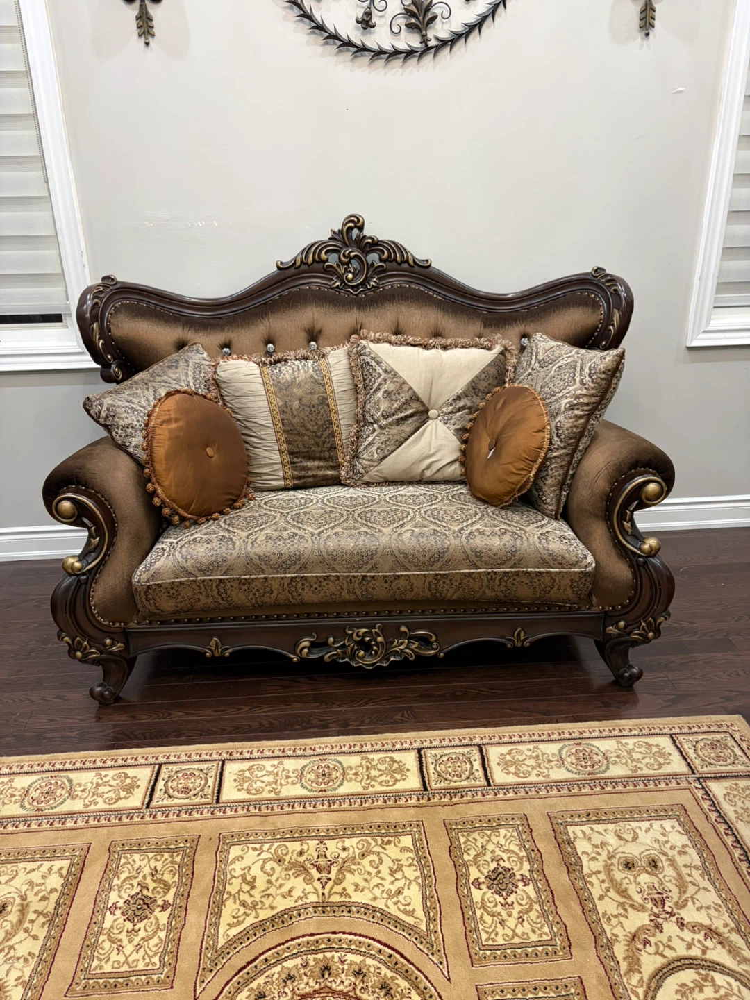 Ornate Brown Sofa with Decorative Pillows