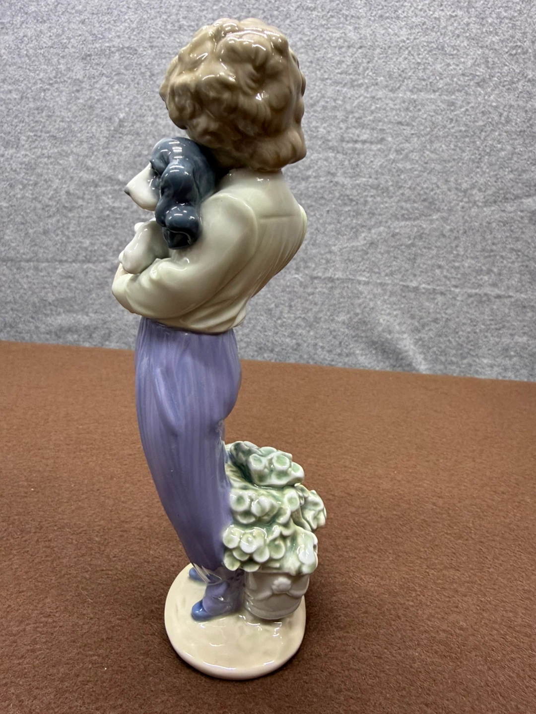 Porcelain Figurine of a Child Holding a Dog with Flowers - photo 4