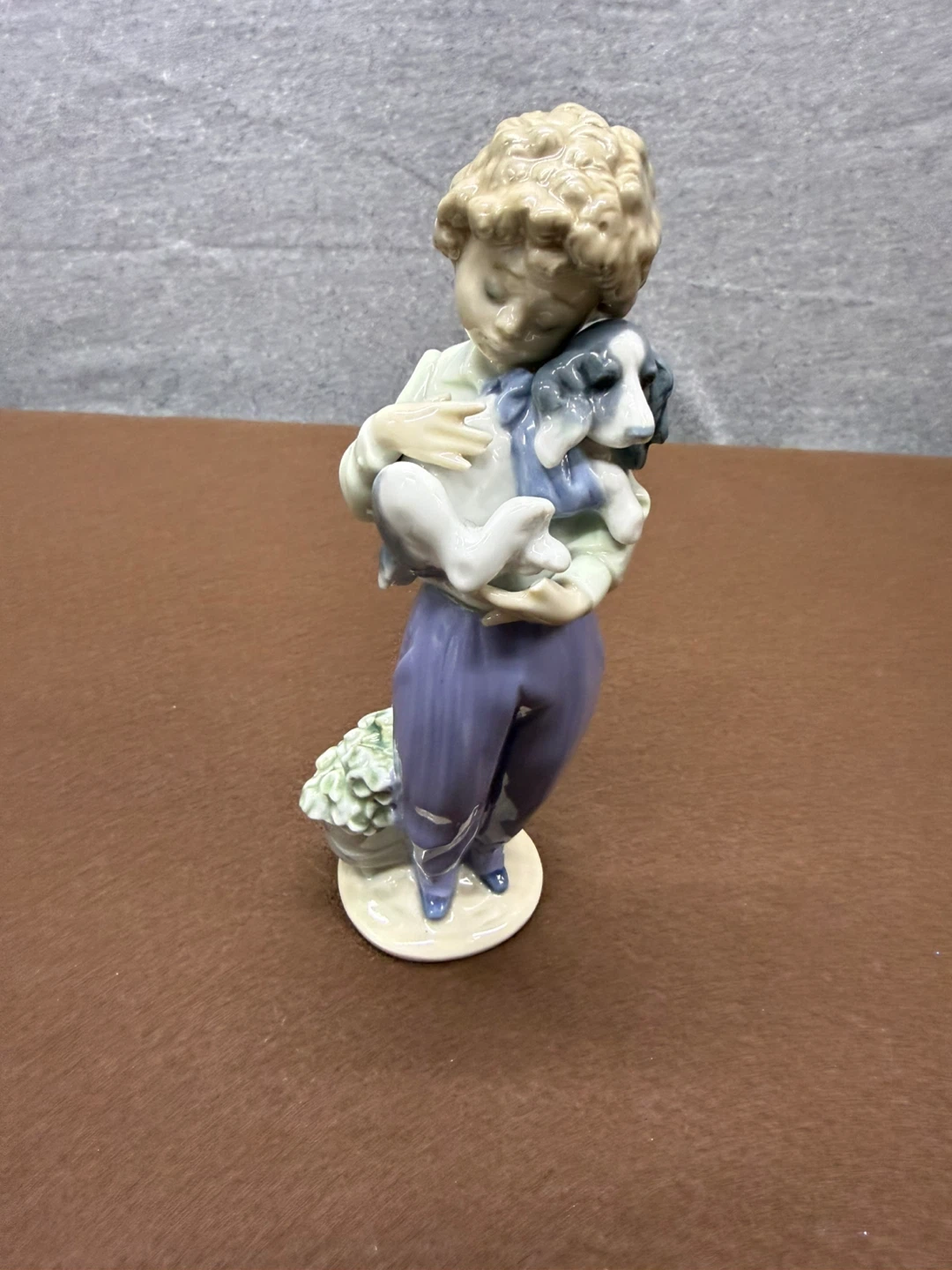 Porcelain Figurine of a Child Holding a Dog with Flowers - photo 2