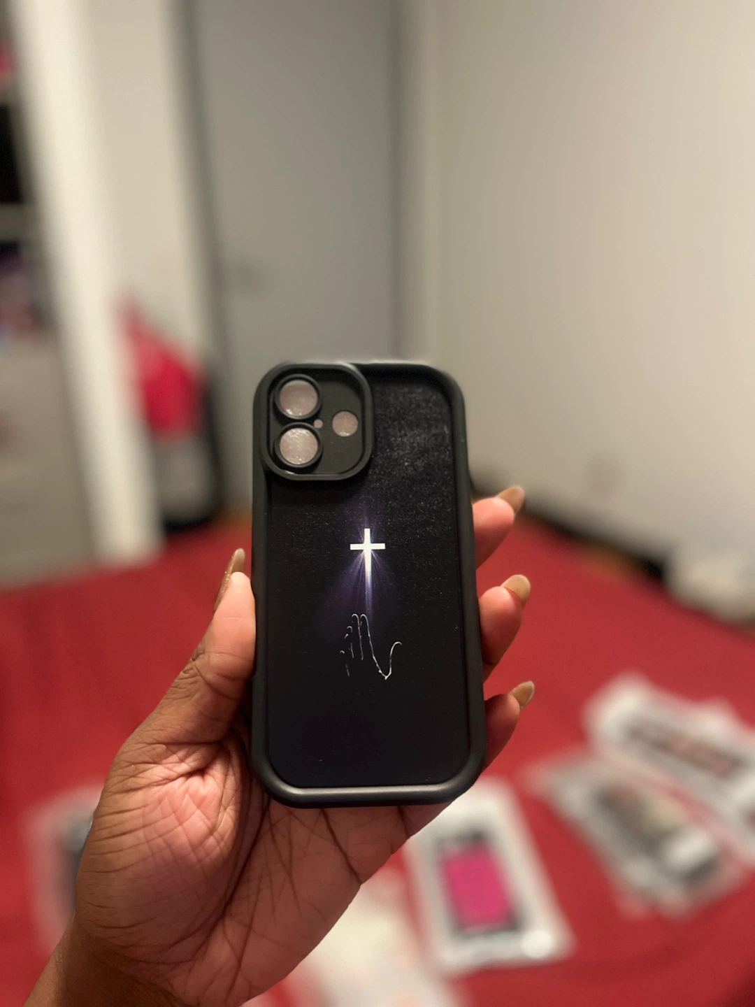 Black iPhone 16 Case with Praying Hands and Cross Design