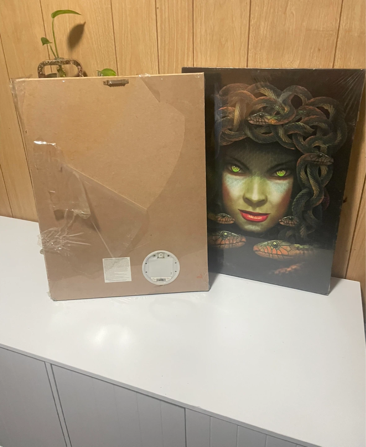 Two Halloween decor paintings
